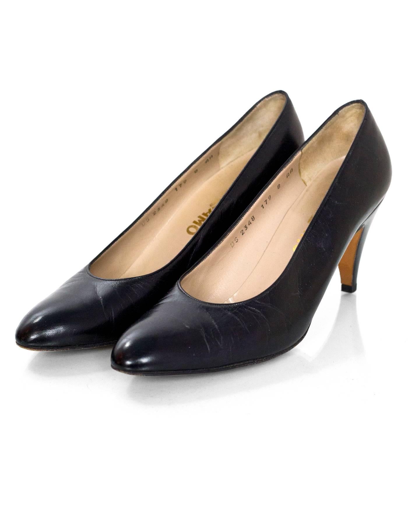 Salvatore Ferragamo Black Leather Pumps Sz 8AA

This is a narrow fit shoe

Made In: Italy
Color: Black
Materials: Leather
Closure/Opening: Slide on
Sole Stamp: Salvatore Ferragamo Made in Italy Leather sole Leather upper
Overall Condition: Very good