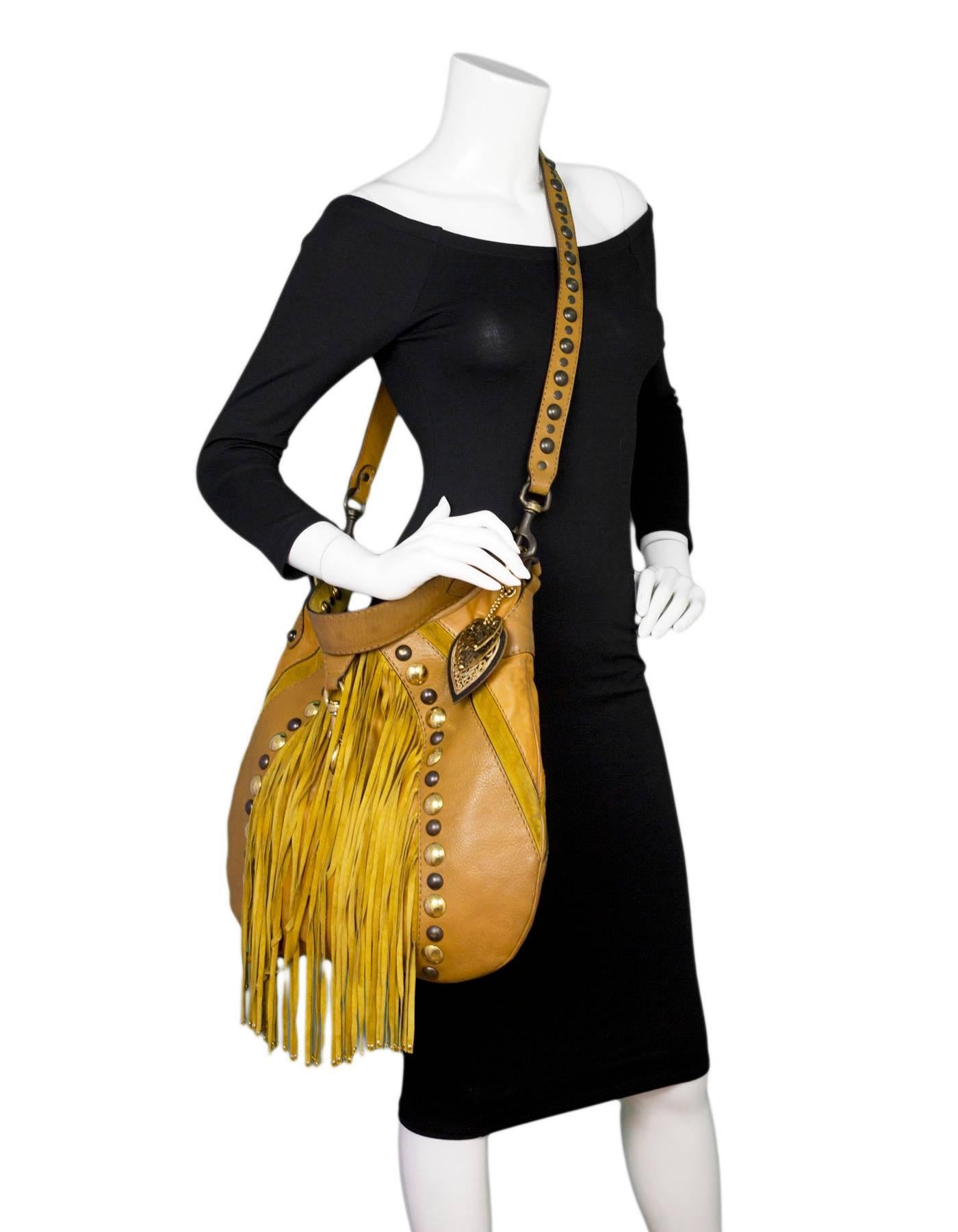 Gucci Tan Leather & Suede Babouska Satchel Bag
Features fringe and studding throughout

Made In: Italy
Color: Tan
Hardware: Goldtone, brass
Materials: Leather, suede, metal
Lining: Brown textile
Closure/Opening: Open top with center