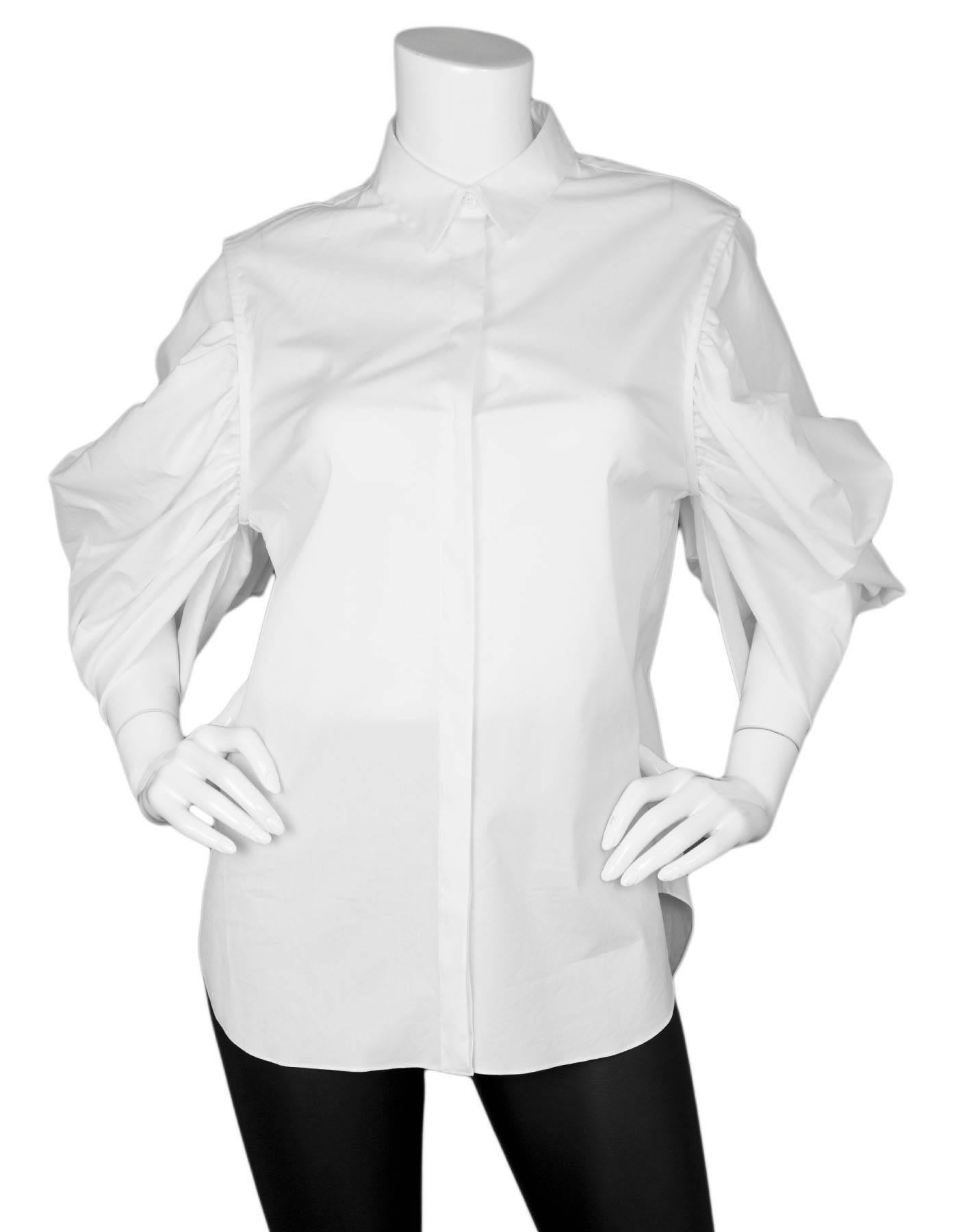 Christian Dior White Cotton Puff Sleeve Blouse Sz FR40 NWT

Made In: Italy
Color: White
Composition: 72% cotton, 23% polyamide, 5% spandex
Lining: None
Closure/Opening: Front button closure
Exterior Pockets: None
Interior Pockets: None
Retail Price: