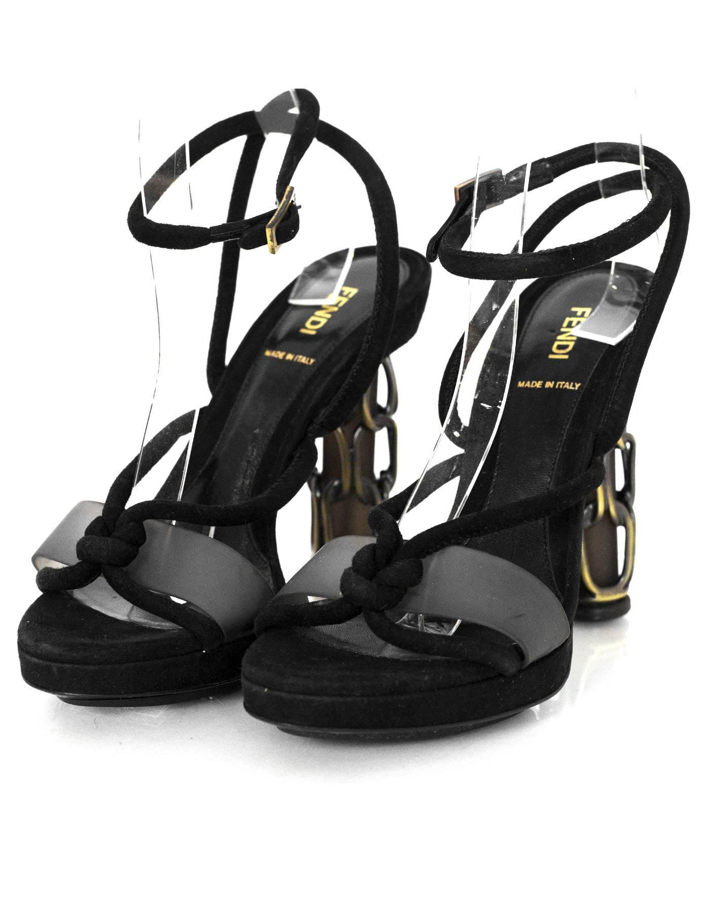 Fendi Black Suede Sandals with Caged Heels Sz 38

Features rubber strap at toes

Made In: Italy
Color: Black
Materials: Suede, metal
Closure/Opening: Buckle closure at ankle
Sole Stamp: Fendi Made in Italy Vero Cuoio 38
Overall Condition: Excellent
