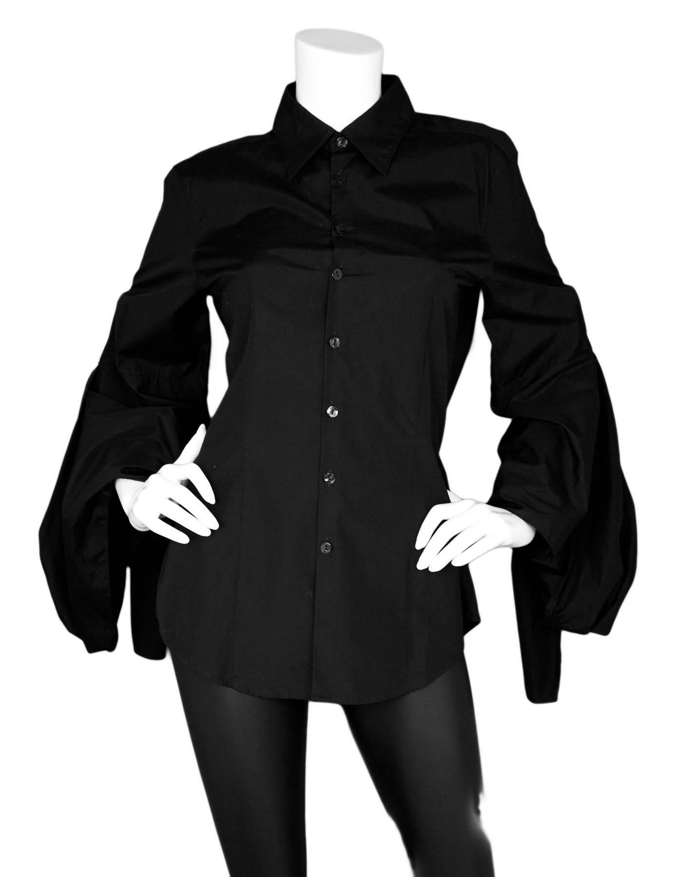 Jean Paul Gaultier Femme Black Blouse with Arm Ties Sz IT44

Made In: Italy
Color: Black
Composition: 100% Cotton 
Lining: None
Closure/Opening: Front buton closure
Overall Condition: Excellent pre-owned condition
Included: Jean Paul Gaultier
