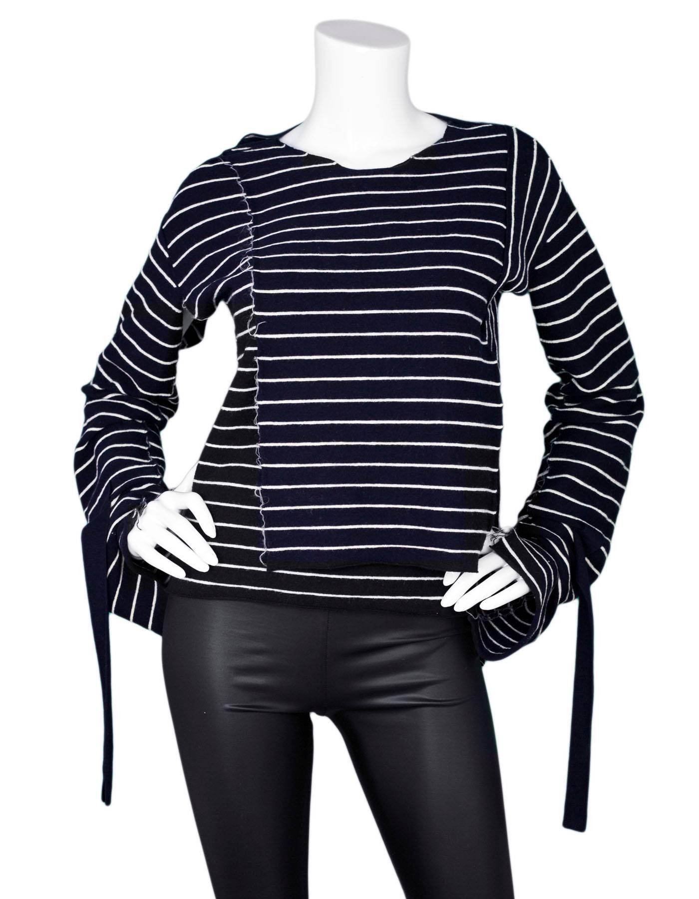 Distressed Celine Navy & White Stripe Top Sz M

Made In: Italy
Color: Navy, white
Composition: 83% Laine, 11% Mohair, 6% Polyamide
Closure/Opening: Pull over
Overall Condition: Excellent pre-owned condition.  Please note this sweater is