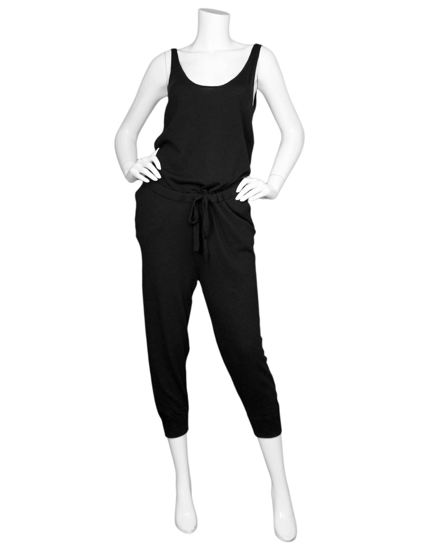 Skin Black Wool Jumpsuit Sz 4 NWT

Made In: China
Color: Black
Composition: 65% superfine wool, 30% Modal, 5% Cashmere
Closure/Opening: Pull-up with drawstring at waist
Exterior Pockets: Slit side pockets
Overall Condition: Excellent pre-owned