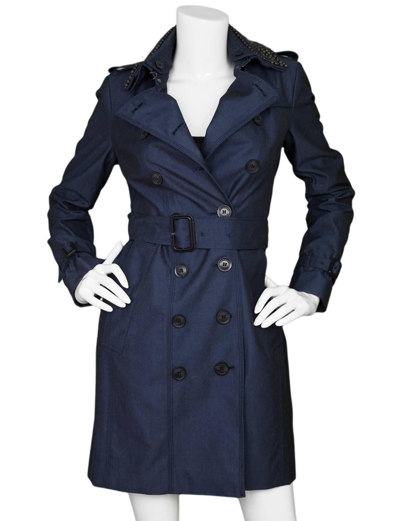 Burberry London Queenshouse Trench Coat Sz US4

Features optional beaded collar

Made In: Bosnia
Color: Blue
Composition: 100% Cotton
Lining: Black plaid nova check
Closure/Opening: Double breasted button closure
Exterior Pockets: Two hip
