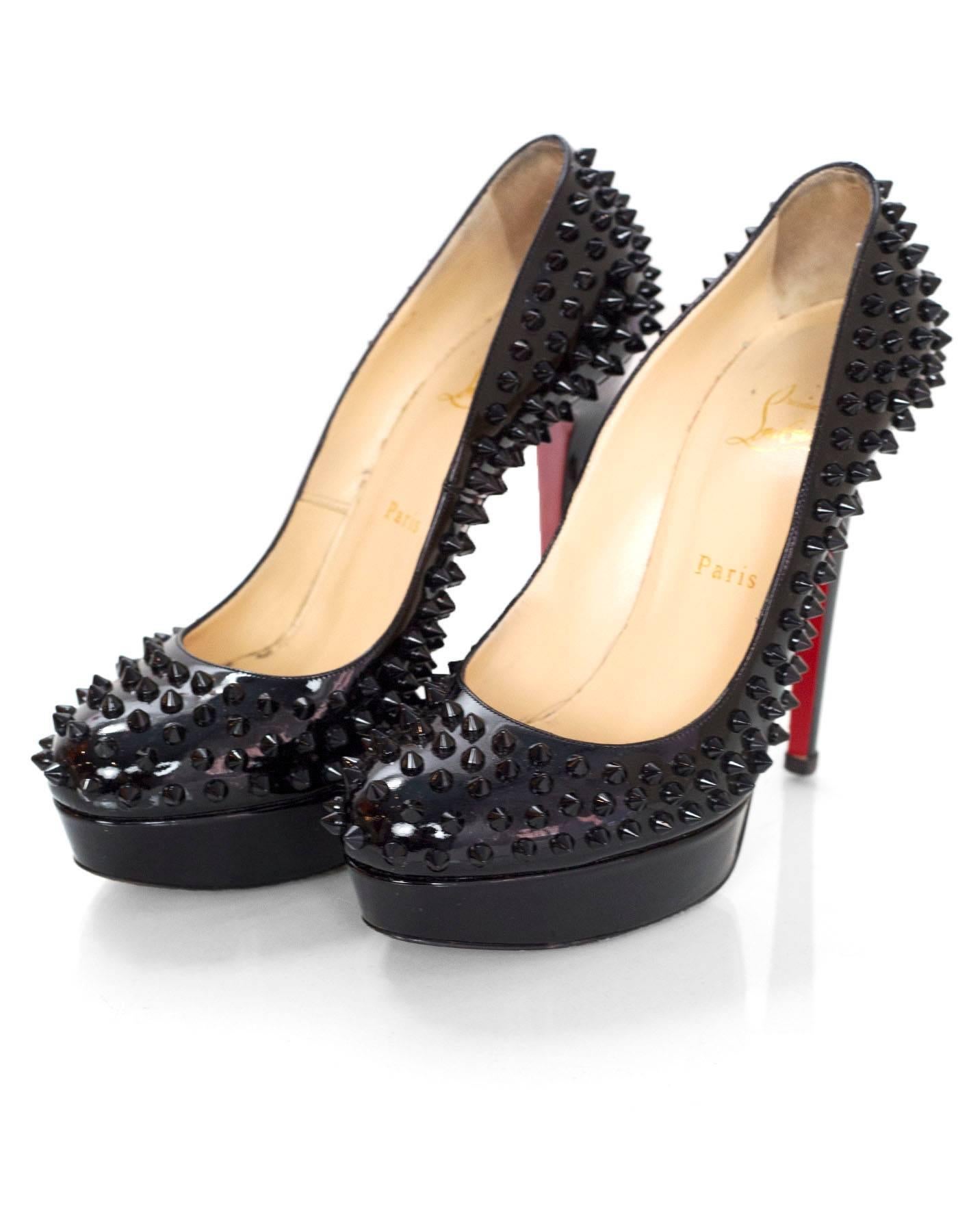Christian Louboutin Black Spike Patent Leather Bianca 140 Pumps Sz 39

Made In: Italy
Color: Black
Materials: Patent leather
Closure/Opening: Slide on
Sole Stamp: Christian Louboutin Made in Italy 39
Retail Price: $1,295 + tax
Overall Condition: