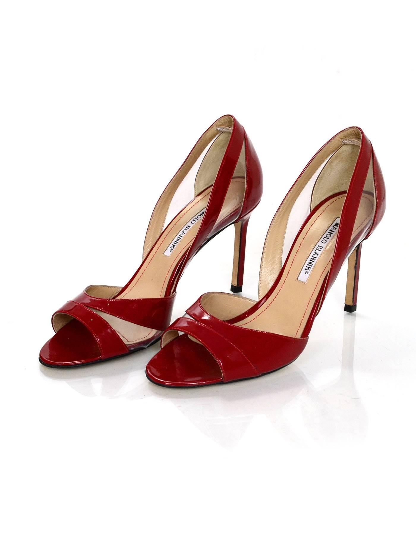 Manolo Blahnik Red Patent Open-Toe d'Orsay Pumps Sz 38

Features PVC sides

Made In: Italy
Color: Red
Materials: Patent leather
Closure/Opening: Slide on
Sole Stamp: Manolo Blahnik Made in Italy 38
Overall Condition: Excellent pre-owned condition