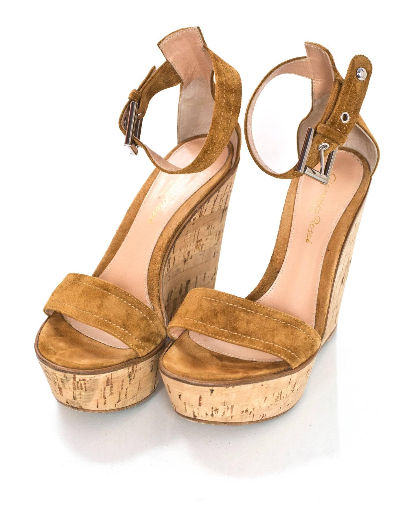 Gianvito Rossi Tan Suede & Cork Wedges Sz 36.5

Made In: Italy
Color: Tan
Materials: Suede, cork
Closure/Opening: Buckle closure at akle
Sole Stamp: Made in Italy Gianvito Rossi 36.5
Retail Price: $695 + tax
Overall Condition: Excellent pre-owned