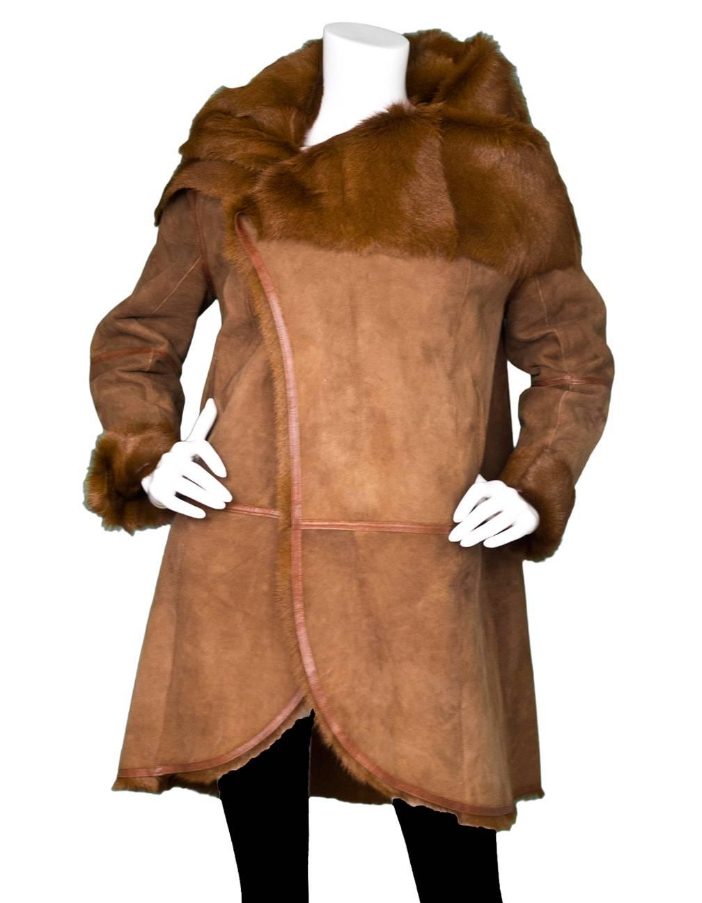 Meteo Brown Goat & Lamb Coat Sz FR40

Made In: France
Color: Brown
Composition: Goat and Lamb fur
Lining: Brown fur
Closure/Opening: Button closure
Exterior Pockets: Two hip pockets
Interior Pockets: None
Overall Condition: Excellent pre-owned