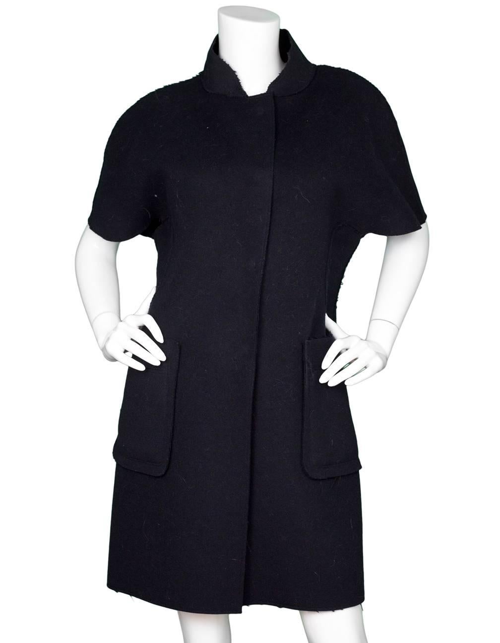 Marni Navy Wool Short Sleeve Coat Sz IT40

Made In: Italy
Color: Navy
Composition: 100% wool
Closure/Opening: Front button closure
Overall Condition: Excellent pre-owned condition
Marked Size: IT40/ US2,4
Bust: 34