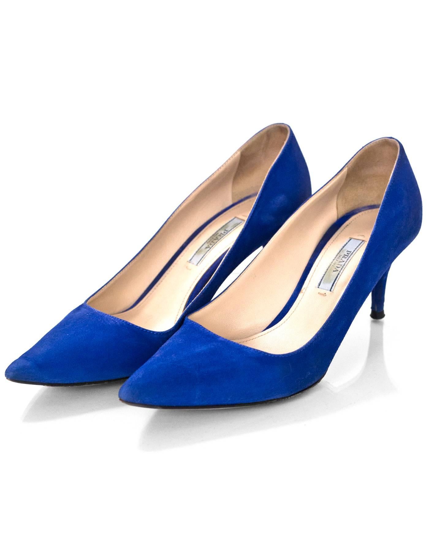 Prada Blue Suede Pumps Sz 37.5

Made In: Italy
Color: Blue
Materials: Suede
Closure/Opening: Slide on
Sole Stamp: Prada 37.5 Made in Italy
Overall Condition: Very good pre-owned condition with the exception of moderate wear at insoles, wear at