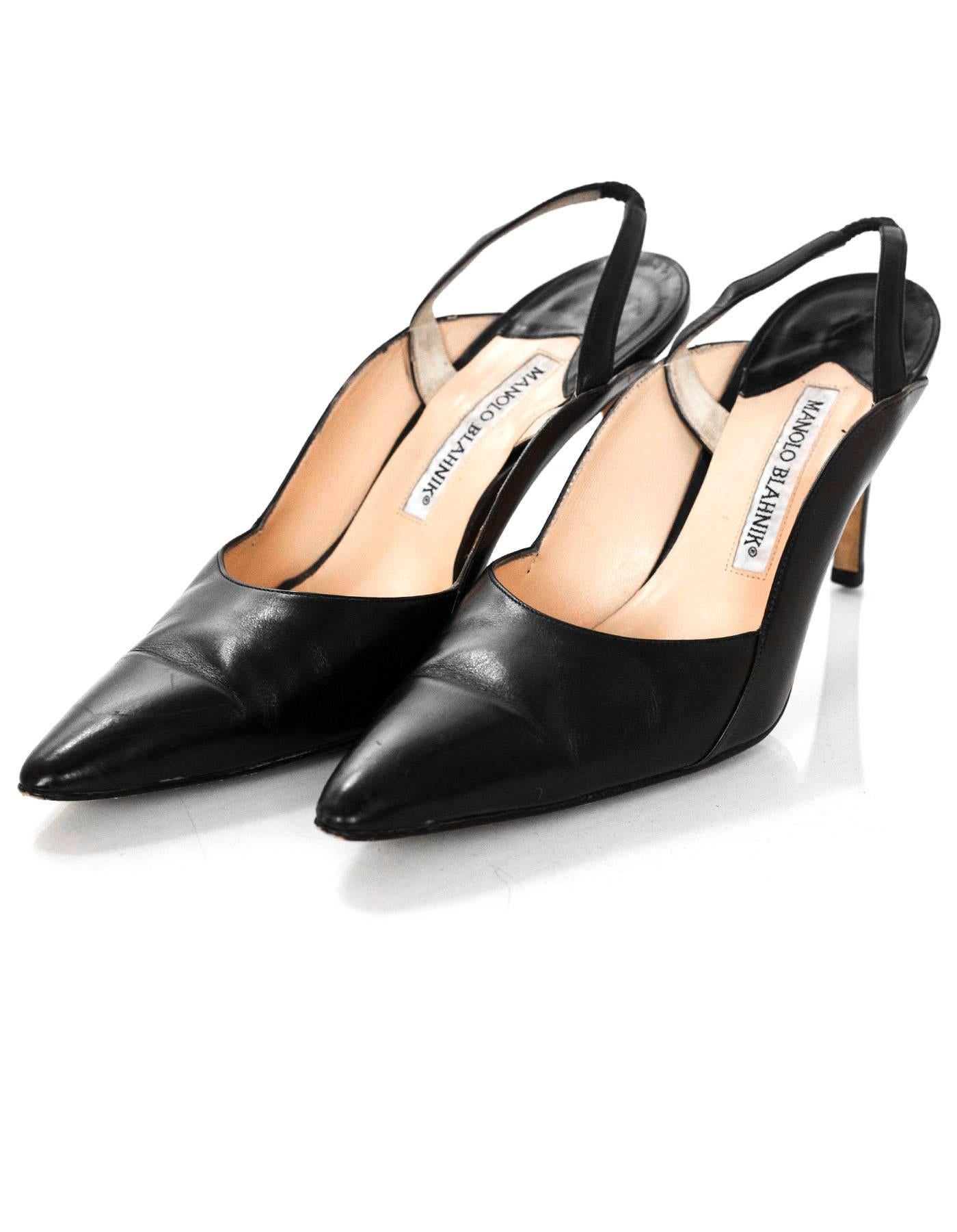 Manolo Blahnik Black & Brown Leather Slingback Pumps Sz 37.5

Made In: Italy
Color: Black, brown
Materials: Leather
Closure/Opening: Slide on
Sole Stamp: Manolo Blahnik Made in Italy 37.5
Overall Condition: Excellent pre-owned condition with the