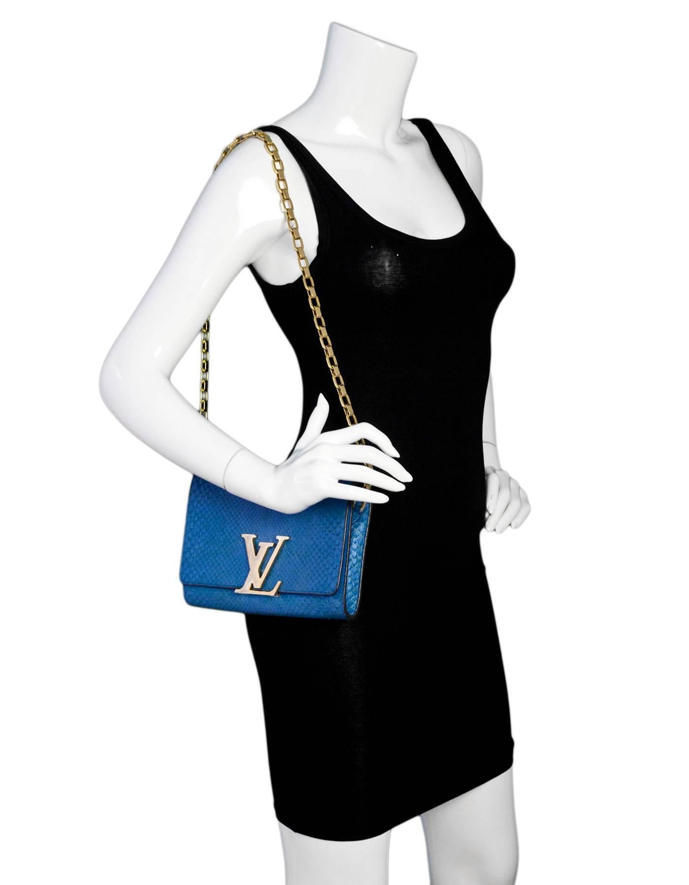 Louis Vuitton Cobalt Blue Python Chain Louise Clutch/Shoulder Bag
**THIS ITEM CAN NOT BE SHIPPED OUTSIDE THE U.S.**
Made In: France
Year of Production: 2014
Color: Cobalt blue
Materials: Python, metal
Lining: Blue leather
Closure/opening: Flap top