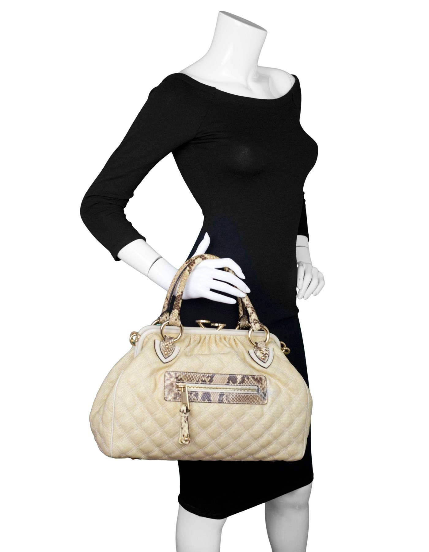 Marc Jacobs Cream Raffia & Python Stam Bag

Made In: Italy
Color: Cream, beige
Hardware: Goldtone
Materials: Python, raffia
Lining: Cream textile
Closure/Opening: Frame bag style with kiss-lock closure
Exterior Pockets: One front zipper