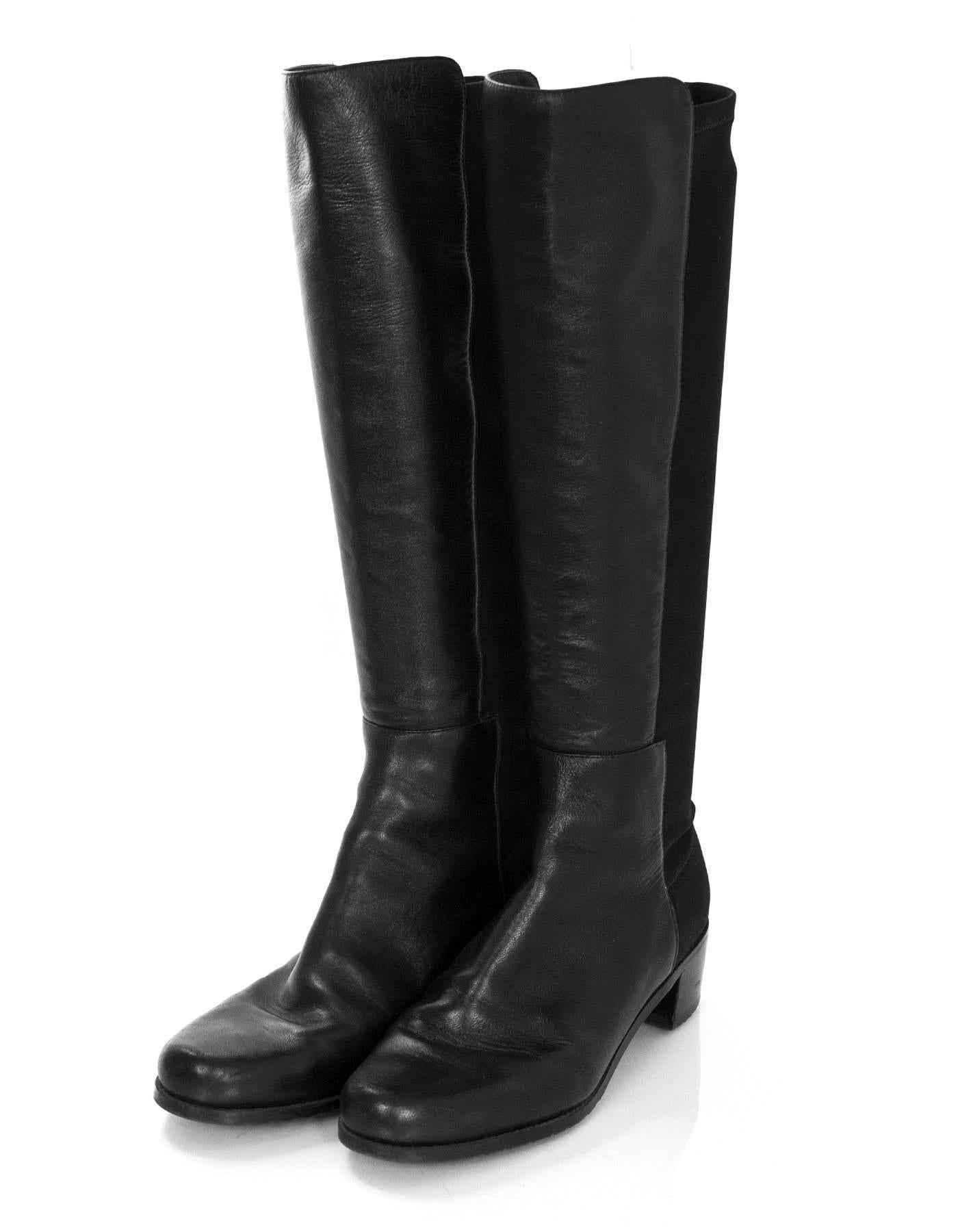 Stuart Weitzman Black Leather 50/50 Knee-High Boots 
Features nylon-blend back panel of shaft for stretch

Made In: Spain
Color: Black
Materials: Leather and nylon
Closure/Opening: Pull on
Sole Stamp: Stuart Weitzman Made in Spain
Overall Condition: