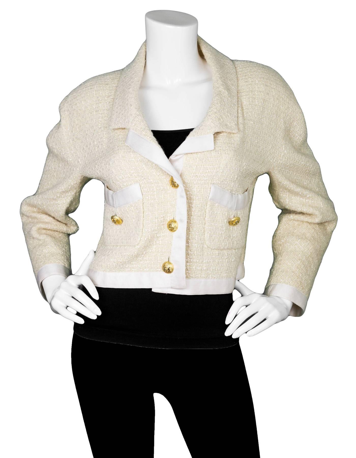 Chanel Vintage Cream Boucle & Satin Cropped Jacket

Color: Cream
Composition: not listed, feels like wool
Lining: Cream textile
Closure/Opening: Front button closure
Overall Condition: Very good vintage pre-owned condition with the exception of some