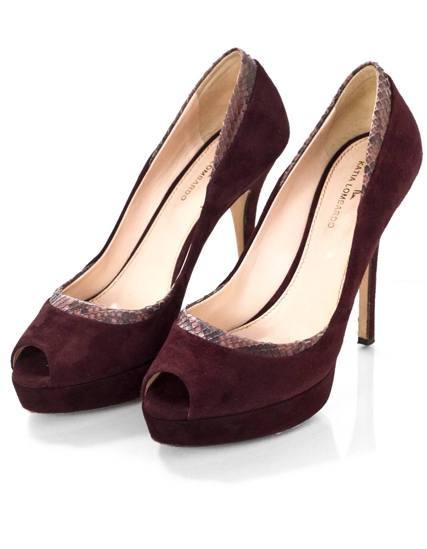 Katia Lombardo Maroon Suede & Snakeskin Pumps Sz 38

Made In: Italy
Color: Maroon
Materials: Suede, snakeskin
Closure/Opening: Slide on
Sole Stamp: Made in italy 38
Overall Condition: Excellent pre-owned condition with the exception of some wear at