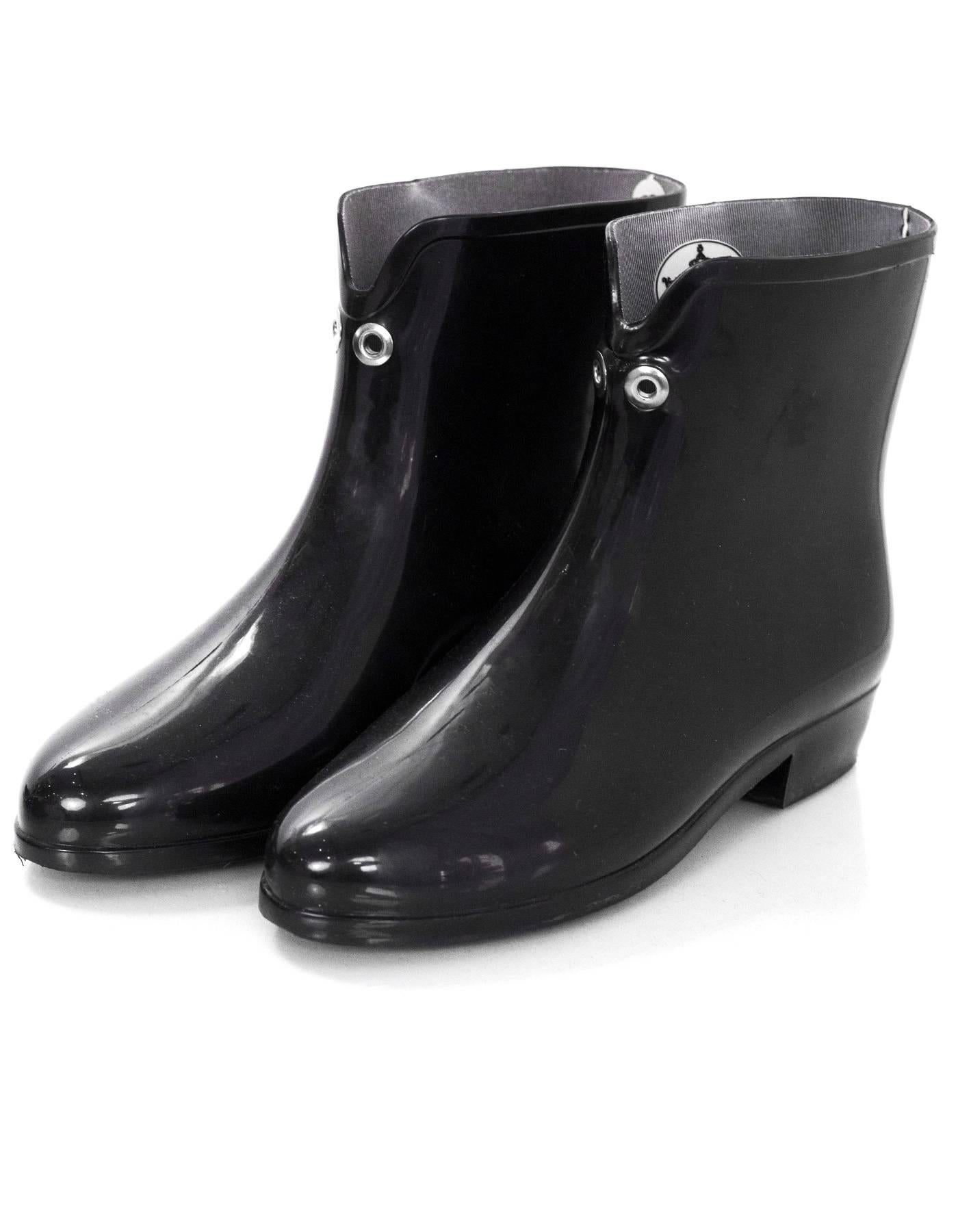 Vivienne Westwood Black Rubber Ankle Rain Boots Sz 37

Made In: Brazil
Color: Black 
Materials: Rubber
Closure/Opening: Pull on
Sole Stamp: Melissa 37 made in bazil
Overall Condition: Excellent pre-owned condition, light wear at outsoles
Marked