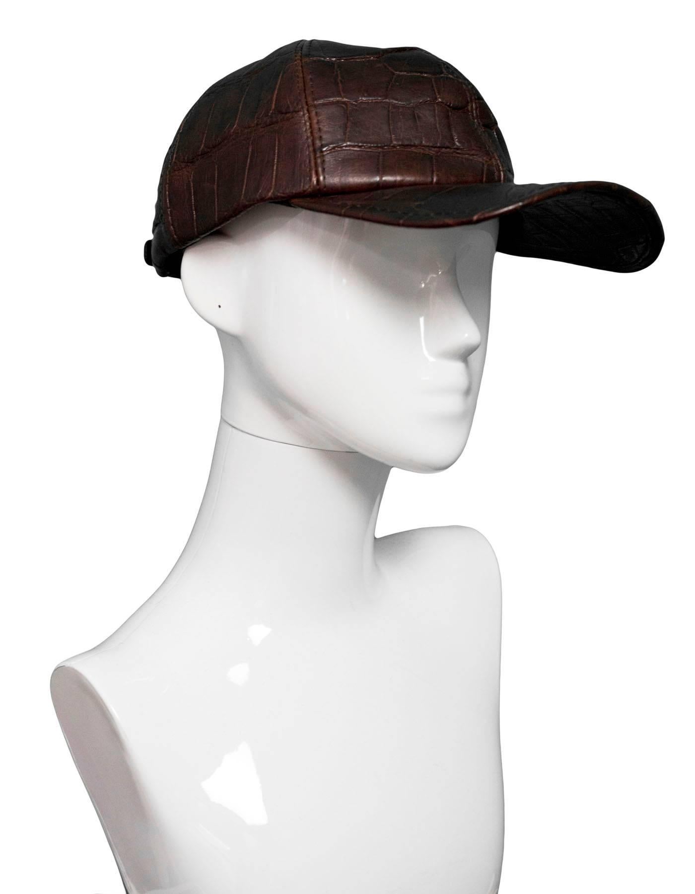 Brown Crocodile Baseball Cap

Color: Brown
Materials: Crocodile
Overall Condition: Excellent pre-owned condition with the exception of some wear and darkening along trim and edges, some wear at interior lining  and headband

Measurements:
Inside