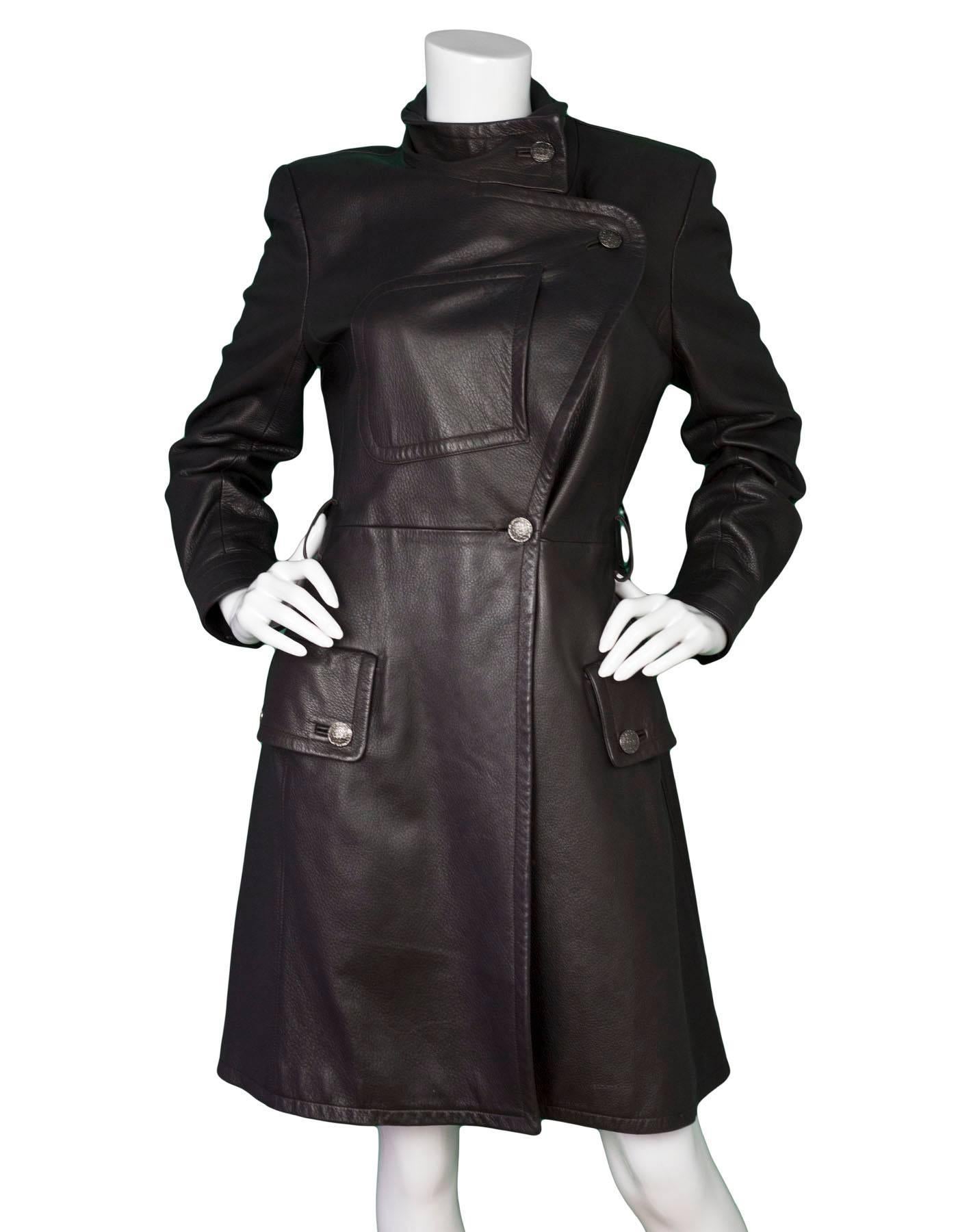 Chanel Dark Brown Leather Trench Coat  
Features optional waist tie

Made In: France
Year of Production: 1997
Color: Dark brown
Composition: 100% leather
Lining: Brown, 100% silk
Closure/Opening: Asymmetrical button down front with waist