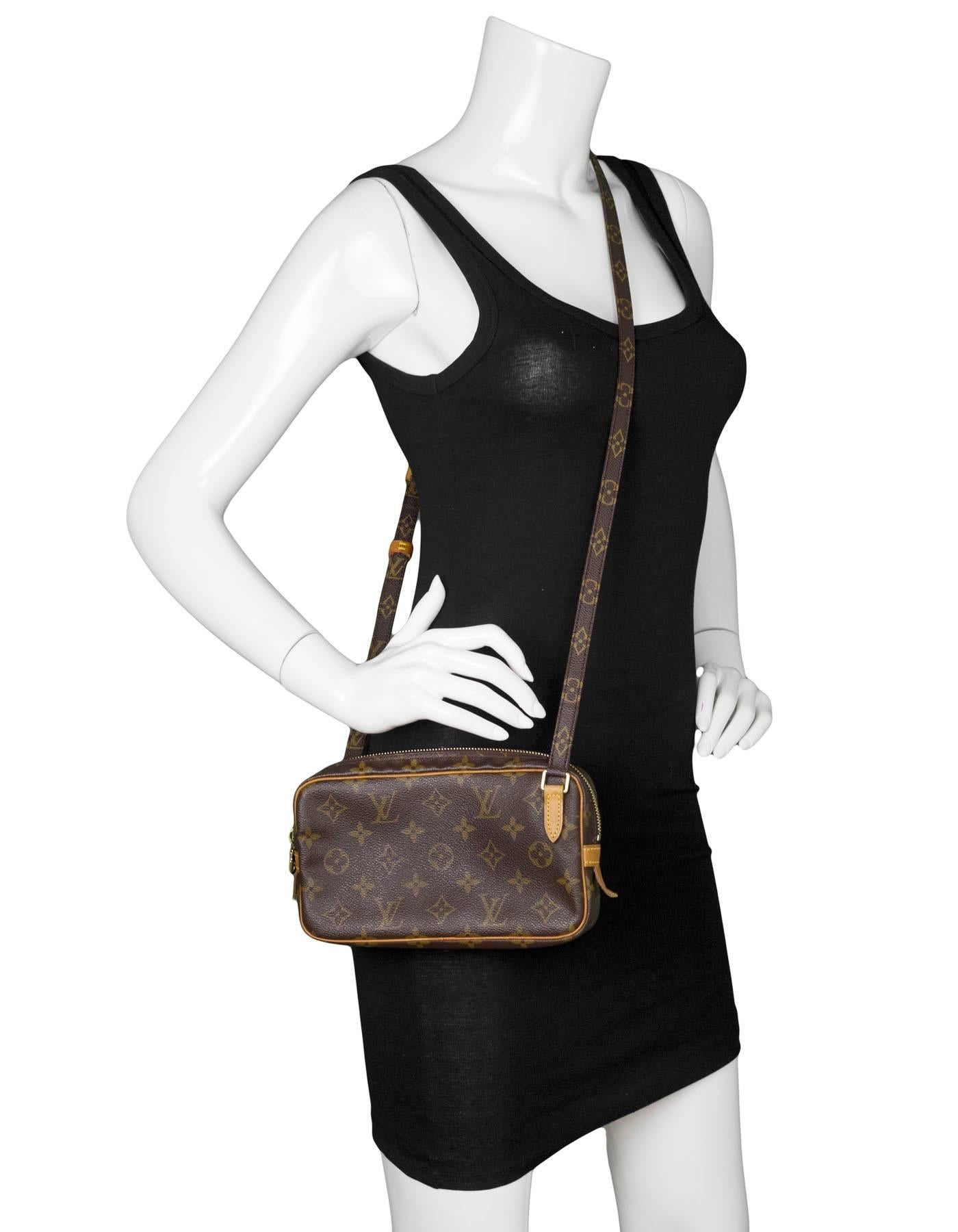 Louis Vuitton Monogram Marly Bandouliere Crossbody Bag

Made In: France
Year of Production: 2000
Color: Brown
Hardware: Goldtone
Materials: Coated canvas and vachetta leather
Lining: Brown coated canvas
Closure/Opening: Zip top closure
Exterior