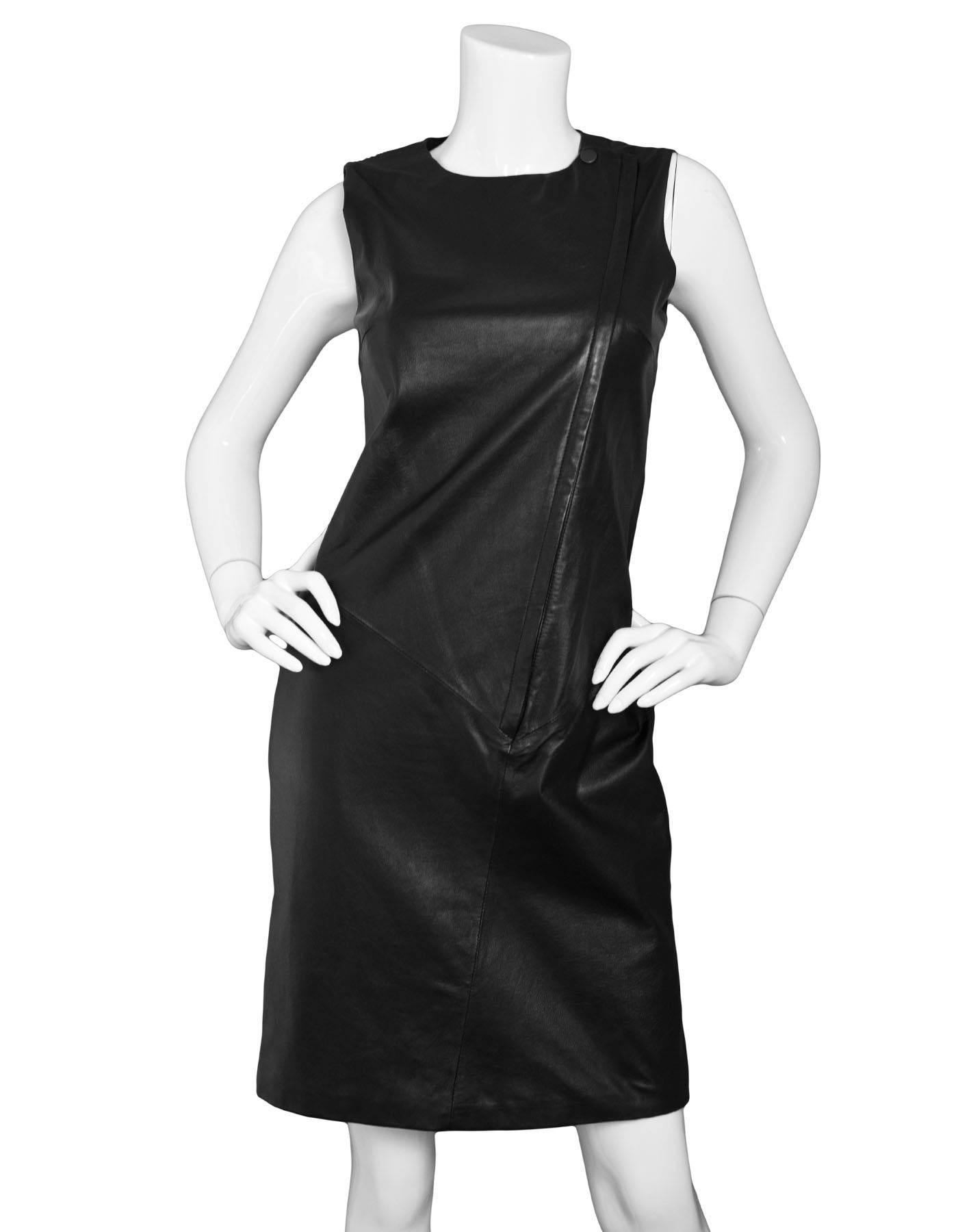 Theory Black Leather Sleeveless Dress Sz 4

Made In: China
Color: Black
Composition: 100% Lambskin
Lining: Black textile
Closure/Opening: Front zip closure
Overall Condition: Excellent pre-owned condition
Marked Size: 4
Bust: 31"
Waist: