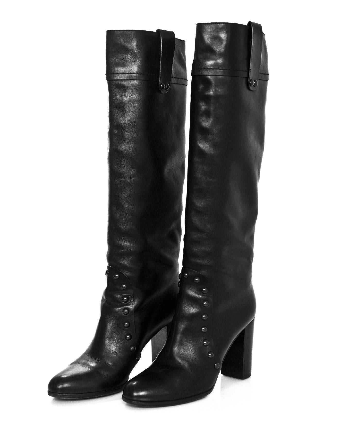 Sergio Rossi Black Leather Studded Boots Sz 38.5

Made In: Italy
Color: Black
Materials: Leather
Closure/Opening: Pull up
Sole Stamp: Sergio Rossi Vero Cuoio Made in Italy 38 1/2
Overall Condition: Excellent pre-owned condition with the exception of