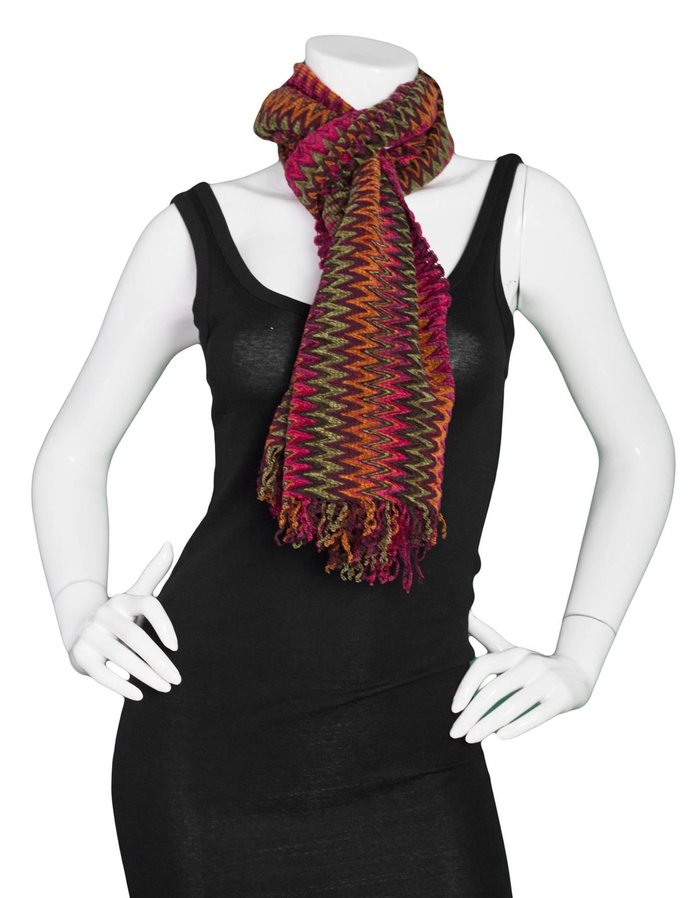 Missoni Multi-Colored Chevron Knit Wool Scarf 
Features fringe on both ends

Made In: Italy
Color: Multi-colored burgundy, magenta, green and orange
Composition: 66% acrylic, 22% wool, 12% nylon
Overall Condition: Excellent pre-owned