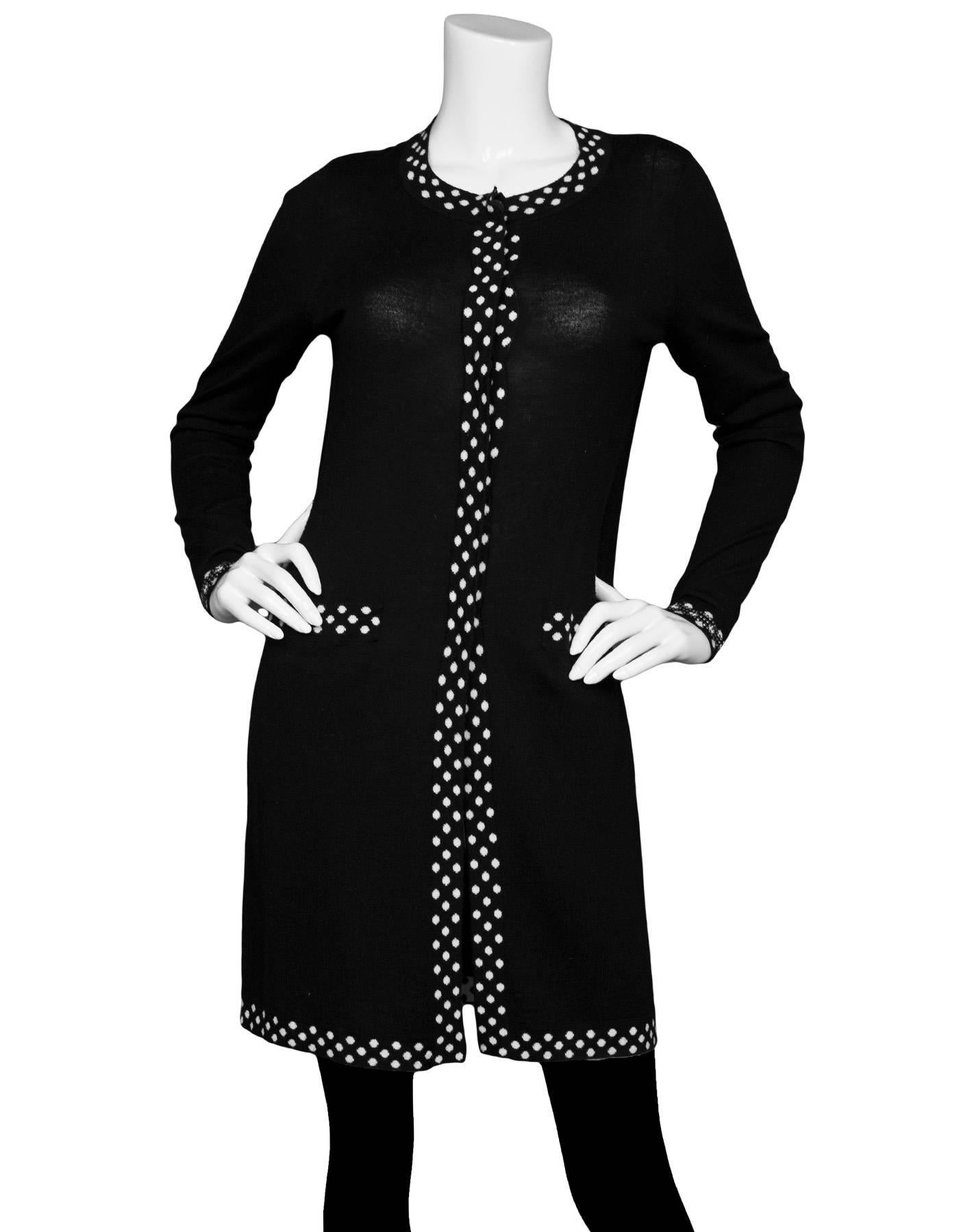 Diane von Furstenberg Black Wool Long Cardigan Sweater 
Features polka dot trim throughout and studs at ends of sleeves

Made In: China
Color: Black and white
Composition: 75% merino wool, 25% silk
Lining: None
Closure/Opening: Button down