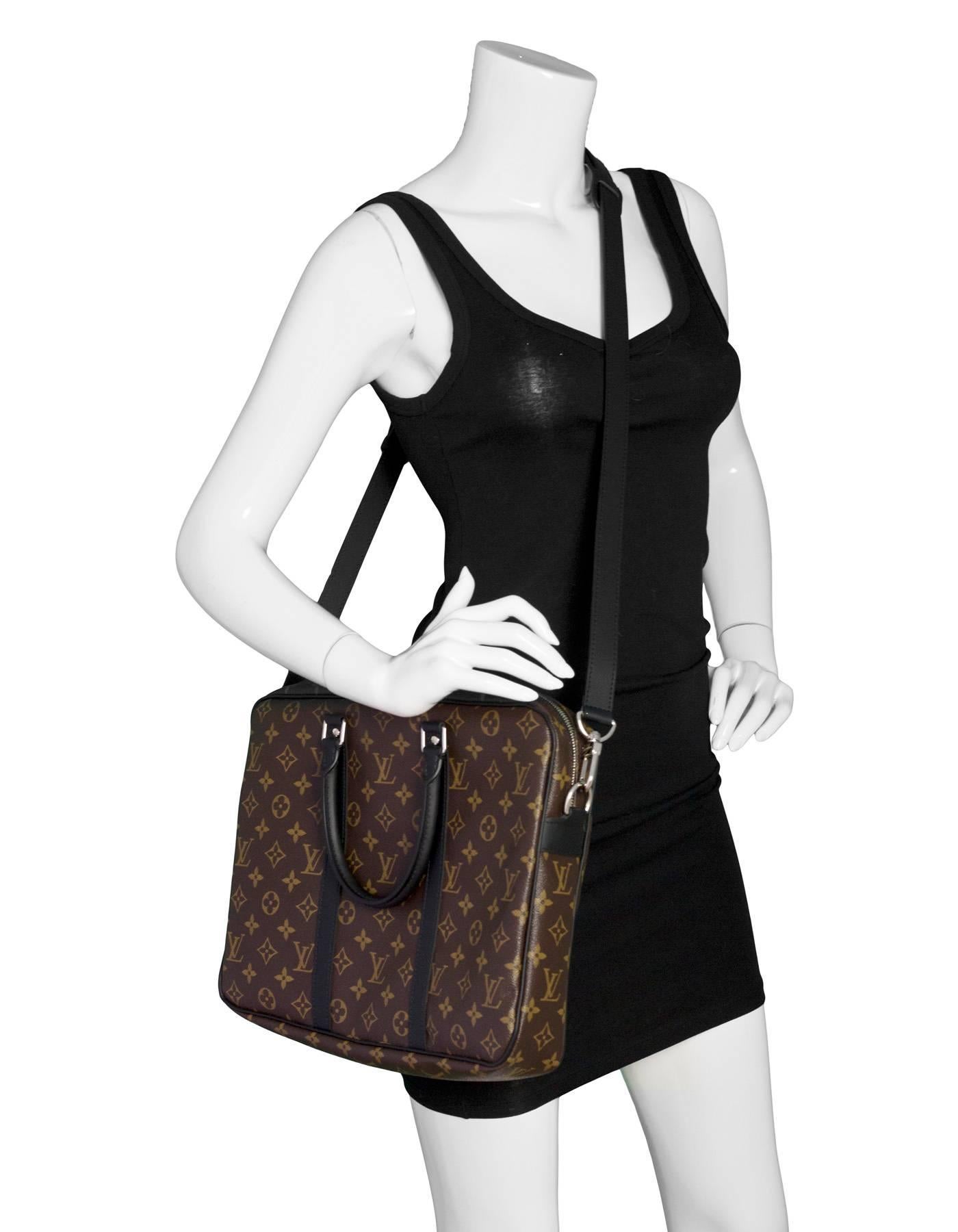Louis Vuitton Monogram Port Documents Voyage PM Satchel

Made In: Spain
Year of Production: 2017
Color: Brown
Hardware: Silvertone
Materials: Coated canvas and leather
Lining: Burgundy canvas
Closure/Opening: Double zip top closure
Exterior Pockets: