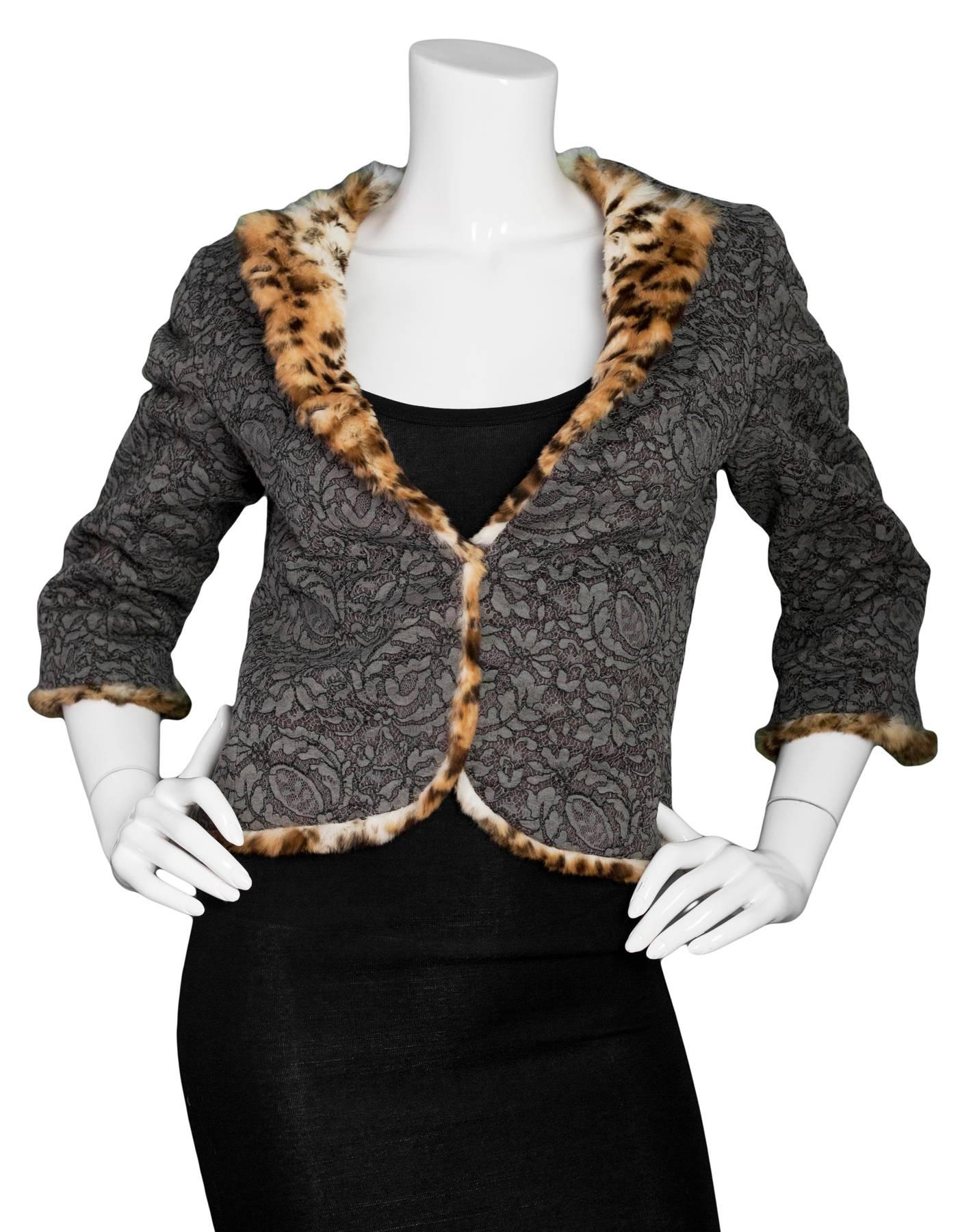 Tuleh Taupe Lace Jacket with Leopard Print Rabbit Trim Sz 6
Features leopard print rabbit fur interior lining

Made In: USA
Color: Taupe
Composition: 80% Cotton, 20% nylon
Lining: Rabbit fur
Closure/Opening: Hidden hook and eyes
Exterior Pockets: