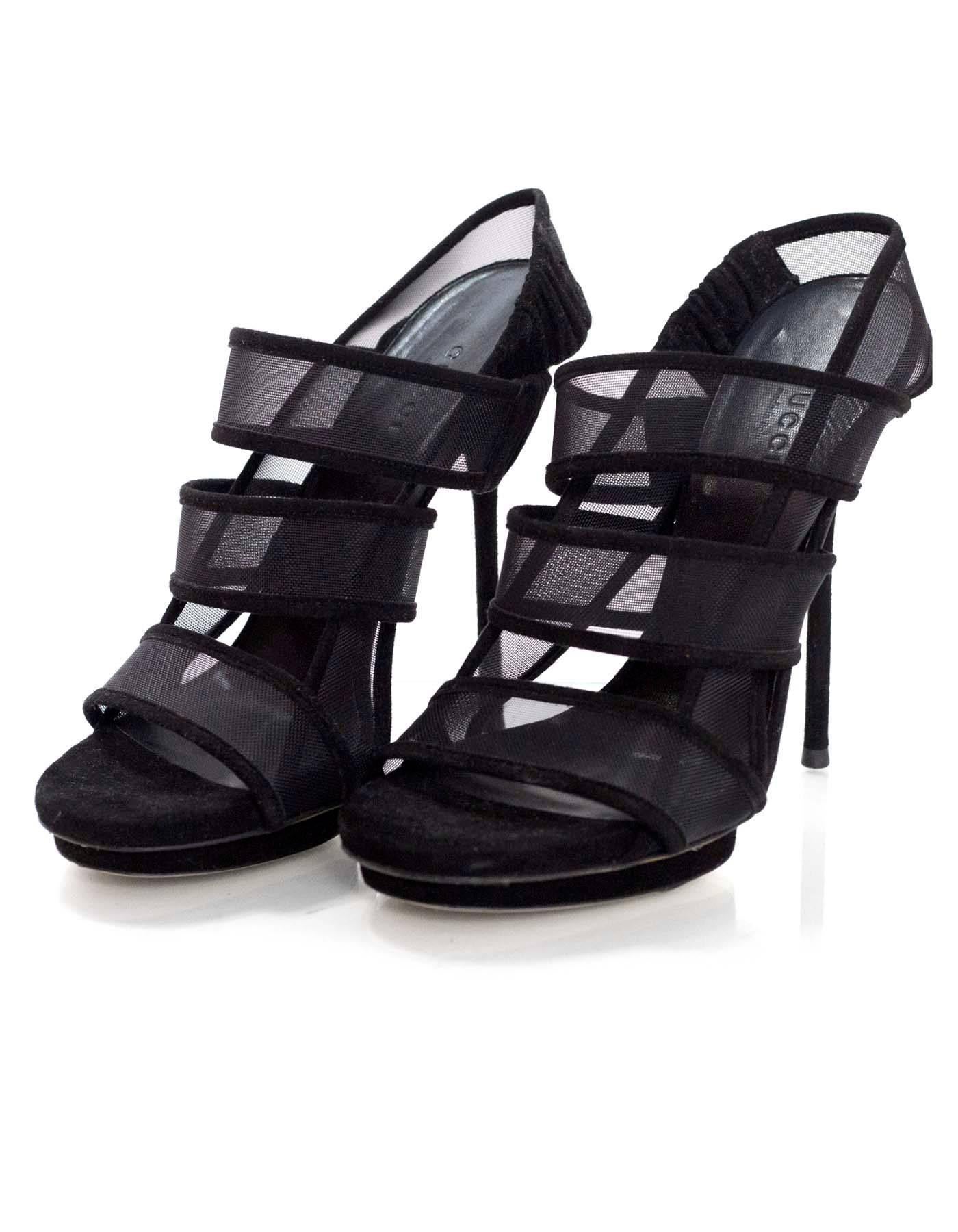 Gucci Black Mesh Strappy Sandals Sz 36

Made In: Italy
Color: Black 
Materials: Mesh, suede
Closure/Opening: Slingback strap
Sole Stamp: Gucci Made in Italy 36
Overall Condition: Excellent pre-owned condition with the exception of extremely light