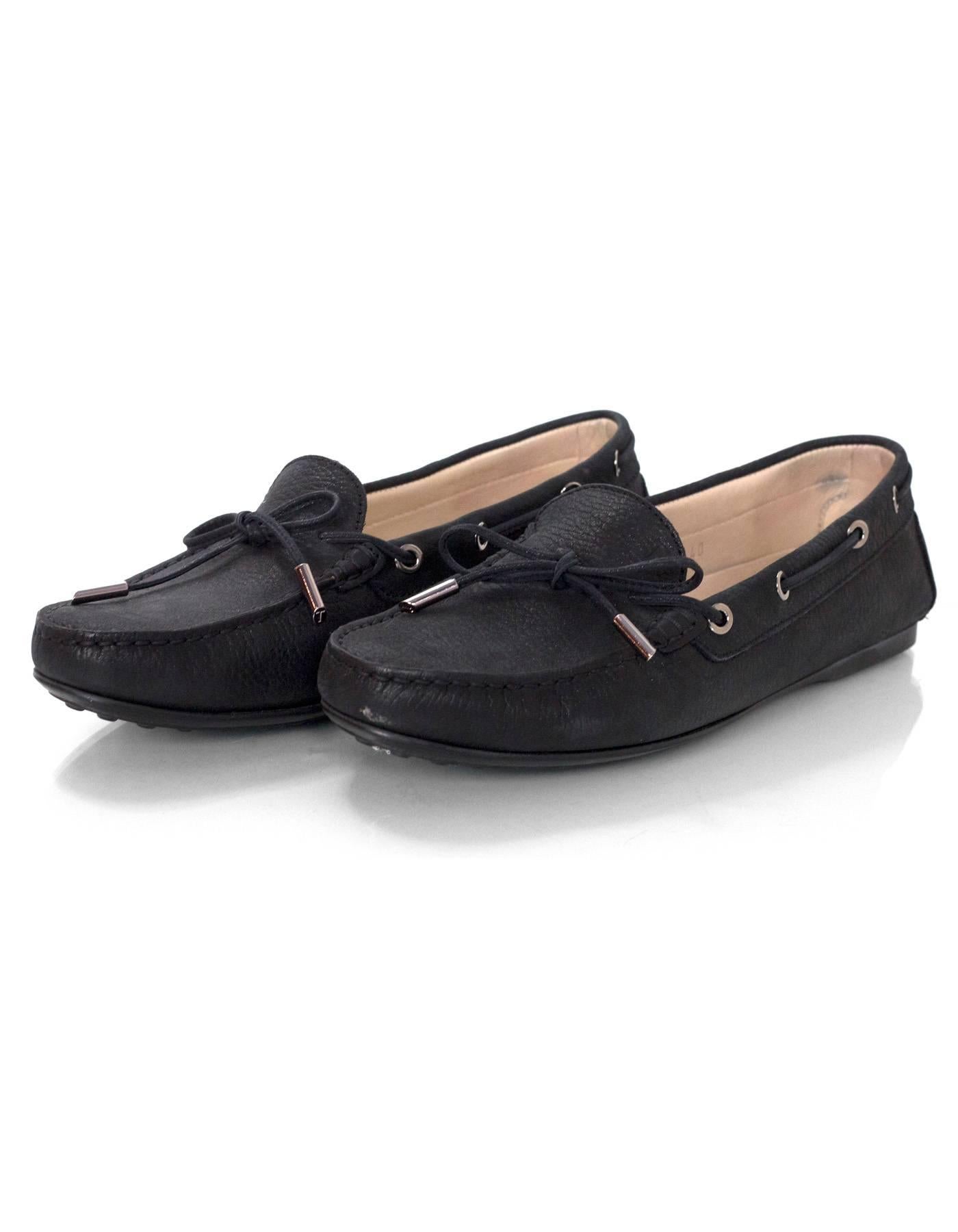 TOD's Black Iridescent Calfskin Driving Loafers Sz 40

Made In: Italy
Color: Black
Materials: Leather
Closure/Opening: Slide on
Sole Stamp: TODS
Overall Condition: Excellent pre-owned condition with the exception of very light wear at