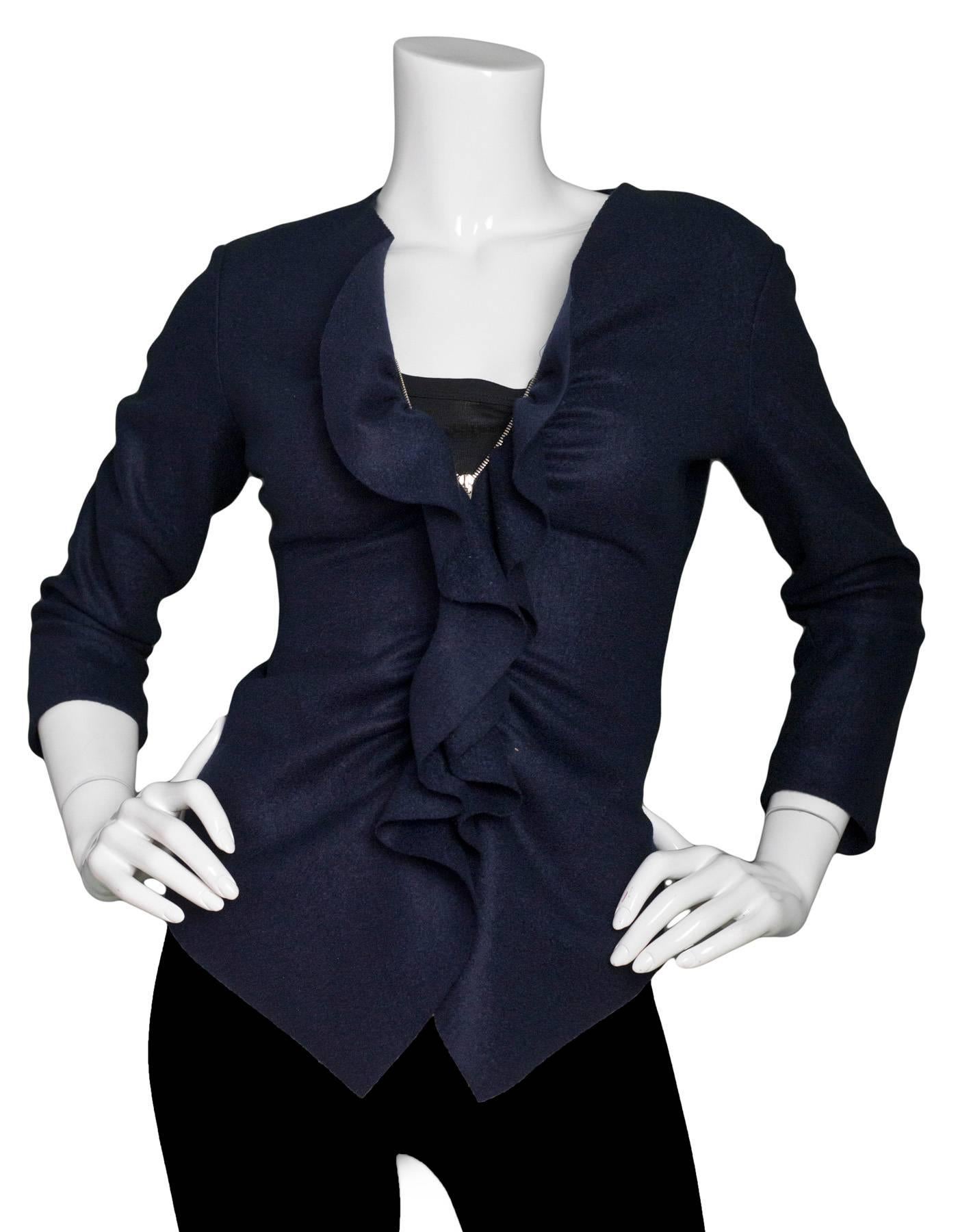 CH Carolina Herrera Navy Wool Ruffle Jacket Sz 2

Color: Navy
Composition: 100% Wool
Lining: None
Closure/Opening: Front double zip closure
Exterior Pockets: None
Interior Pockets: None
Overall Condition: Excellent pre-owned condition
Marked Size: