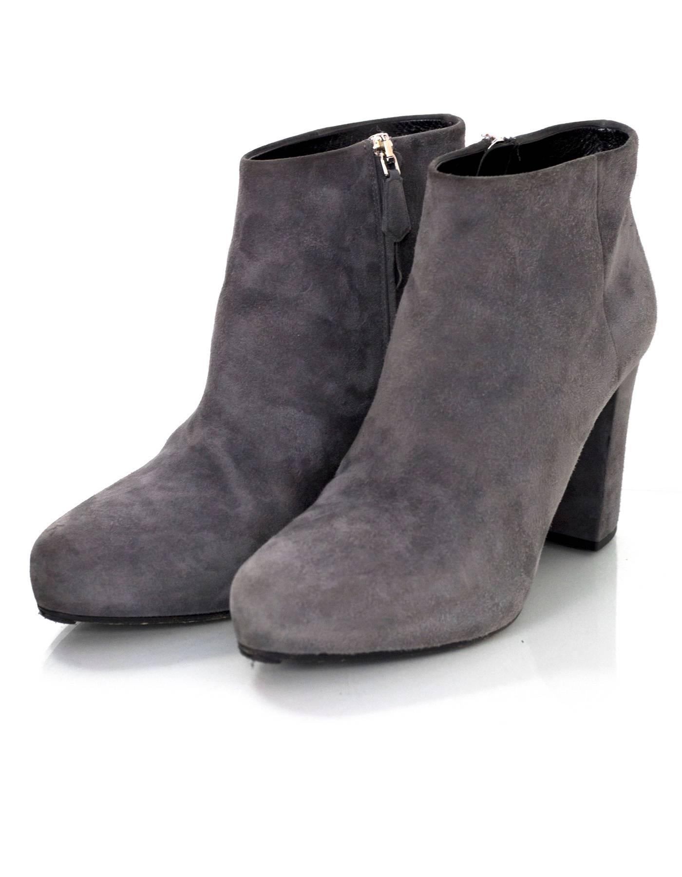 Prada Grey Suede Ankle Boots Sz 39

Made In: Italy
Color: Grey
Materials: Suede
Closure/Opening: Side zip closure
Sole Stamp: Prada 39 Made in Italy
Overall Condition: Very good pre-owned condition with the exception of some wear at outsoles, toe