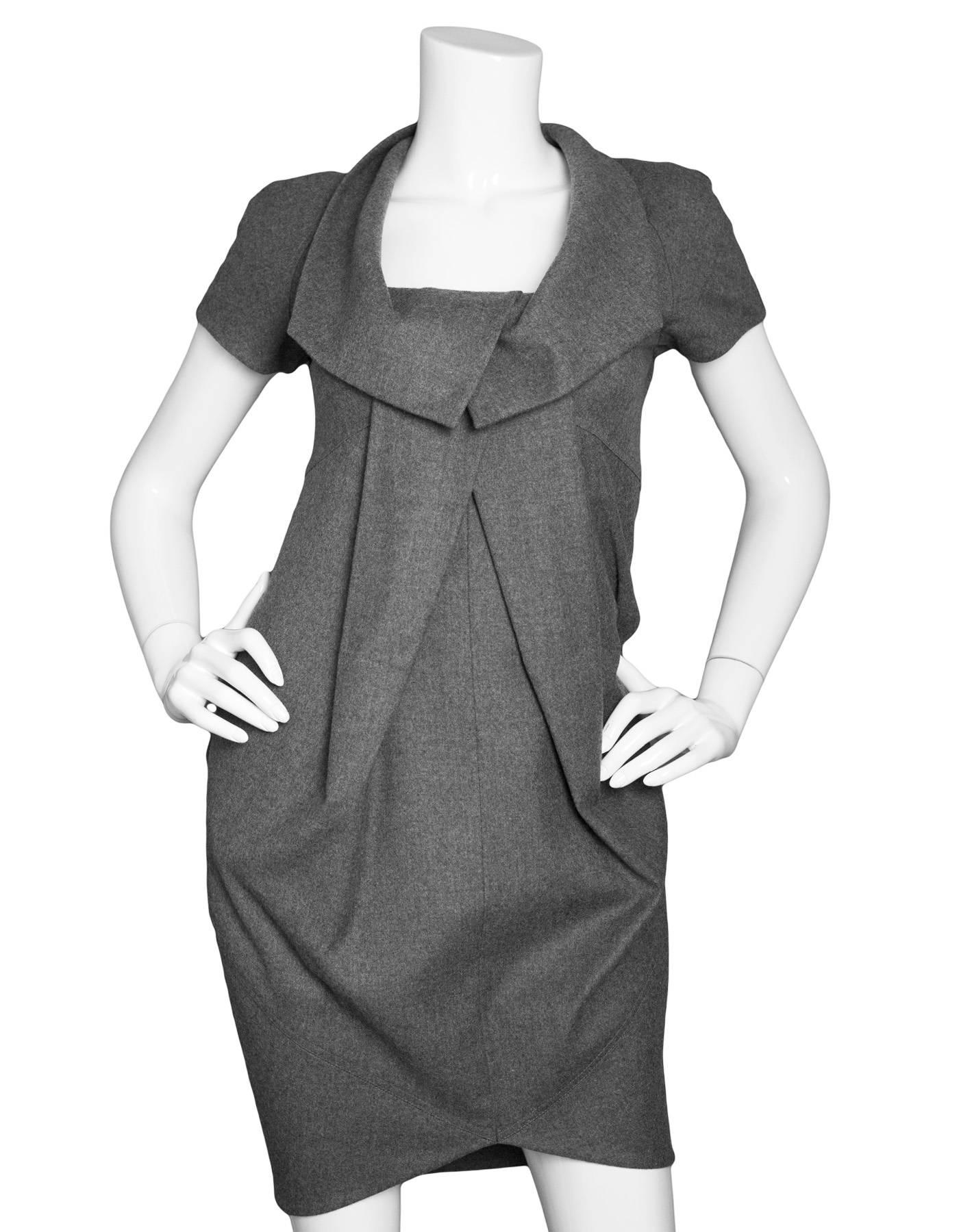 Fendi Grey Wool Pleated Dress Sz IT36

Made In: Italy
Color: Grey
Composition: 95% Fleecewool, 3% nylon, 2% elastane
Closure/Opening: Back zip closure
Exterior Pockets: None
Overall Condition: Excellent pre-owned condition 
Marked Size: IT36/