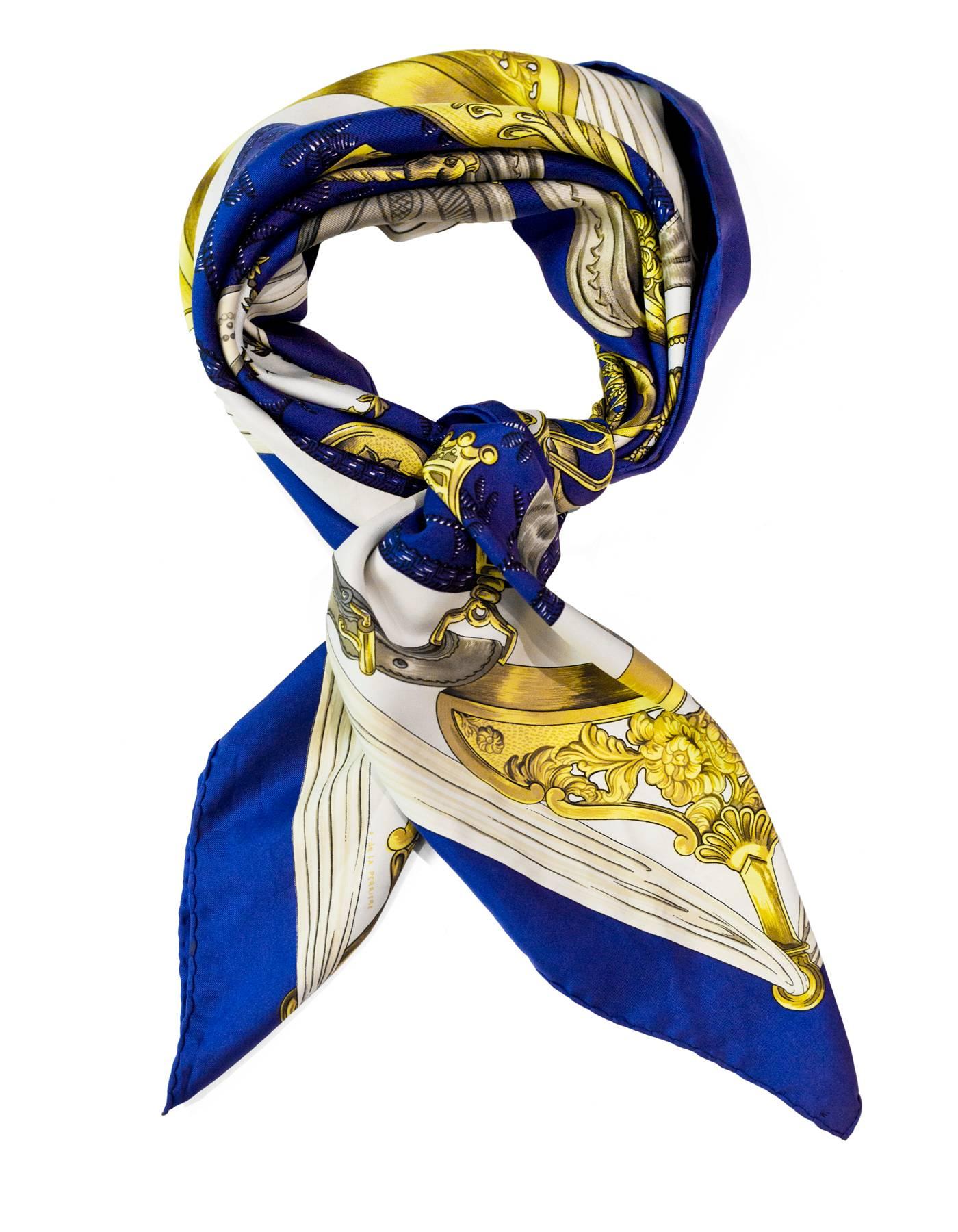 Hermes Blue & Gold Etriers Silk 90cm Scarf

Color: Blue, gold, white
Composition: 100% Silk
Retail Price: $395 + tax
Overall Condition: Very good pre-owned condition with the exception of some soiling/light stains