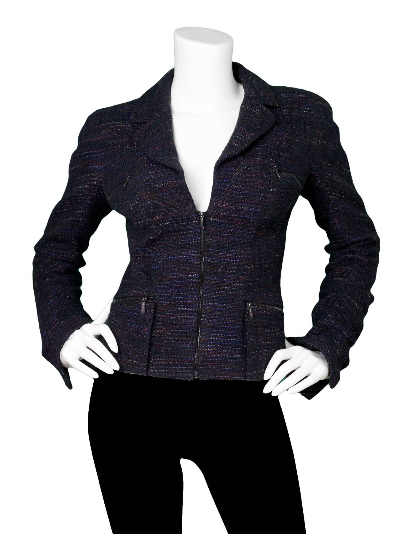 Chanel Multi-Colored Tweed Jacket 
Features crystal details on zipper pulls of pockets

Made In: France
Year of Production: 2002
Color: Black and multi-colored
Composition: 55% acrylic, 20% nylon, 14% cotton, 11% polyester
Lining: Black, 95% silk,