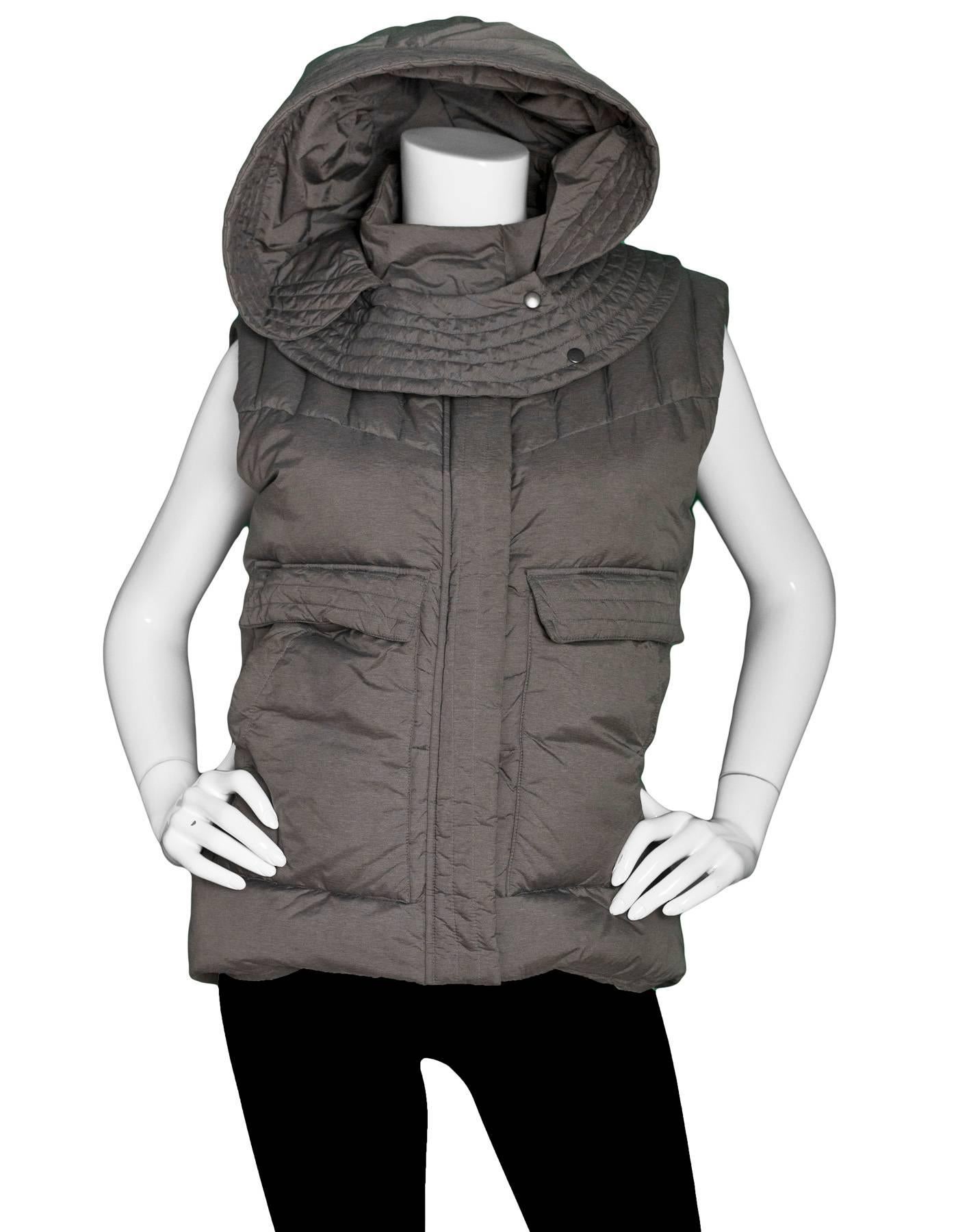 Helmut Lang Grey Nylon Plex Hooded Puffer Vest 

Made In: China
Color: Grey
Composition: 100% Nylon
Lining: Grey, 100% polyester
Closure/Opening: Zip up and snap button front
Exterior Pockets: Two hip pockets
Interior Pockets: Two snap pockets and