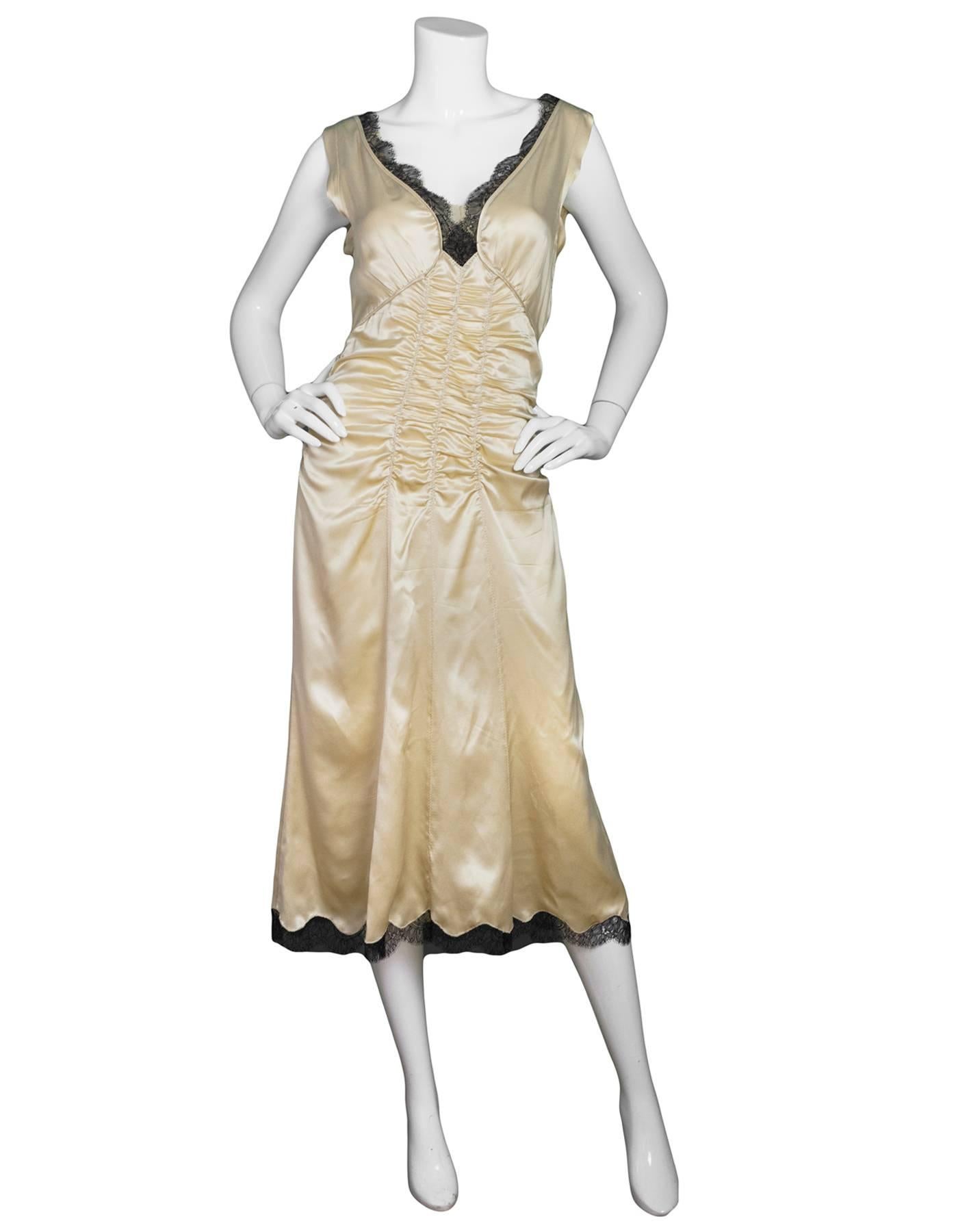 Prada Champagne Silk Ruched Slip Dress 
Features black lace trim at neck and hemline

Made In: Italy
Color: Champagne-beige
Composition: 100% silk
Lining: None
Closure/Opening: Side exposed zipper
Exterior Pockets: None
Interior Pockets: