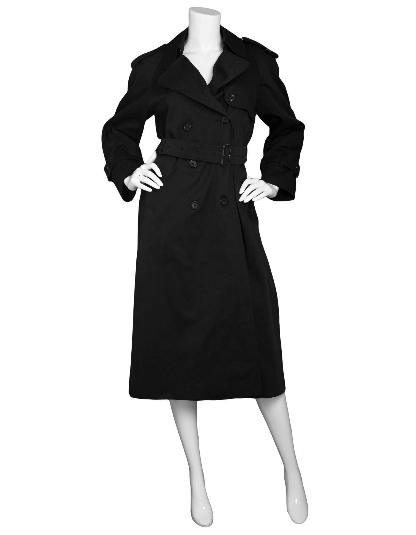 Burberry London Black Cotton Trench Coat 
**Note: Originally sold with a detachable lining- this coat is missing the detachable lining**
Features optional waist belt

Color: Black
Composition: 51% cotton, 49% polyester
Lining: Nova plaid, 50%