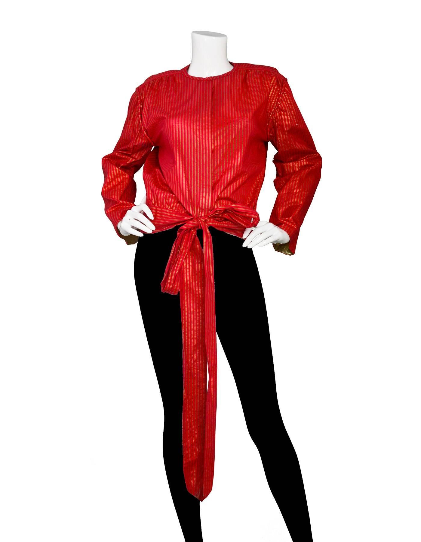 Giorgio Armani Vintage Red & Gold Stripe Wrap Blouse 
Features gold lame detail on lining of sleeves

Made In: Italy
Color: Red and metallic gold
Composition: 100% cotton
Lining: None
Closure/Opening: Button down closure with wrap tie at