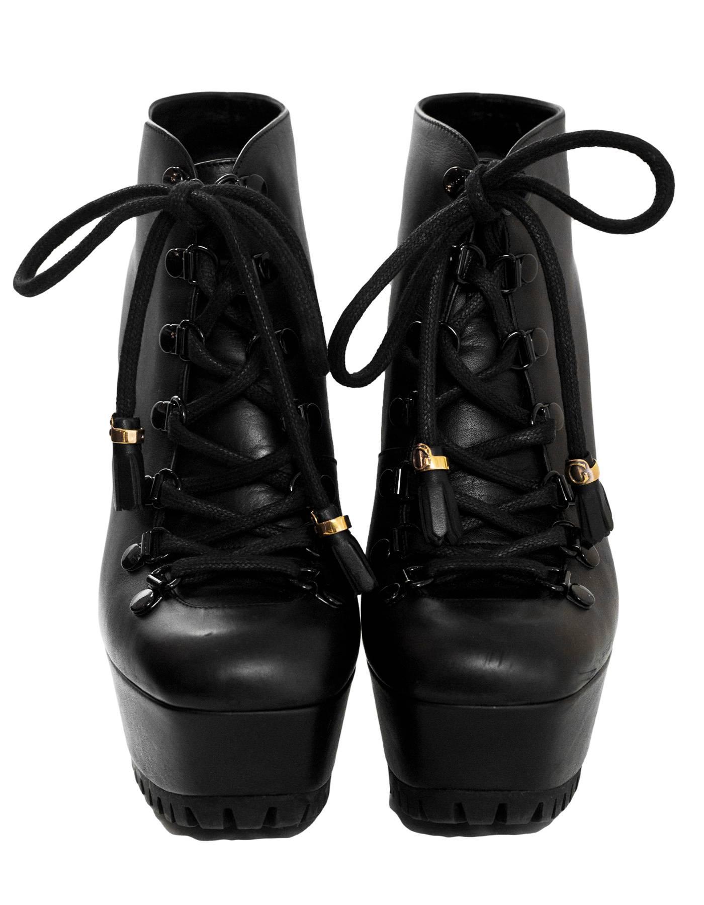 Gucci Black Leather Kayla Lace-Up Ankle Boots Sz 37

Made In: Italy
Color: Black
Materials: Leather
Closure/Opening: Lace tie closure
Sole Stamp: Gucci Made in Italy 37
Retail Price: $1,195 + Tax
Overall Condition: Excellent pre-owned condition with