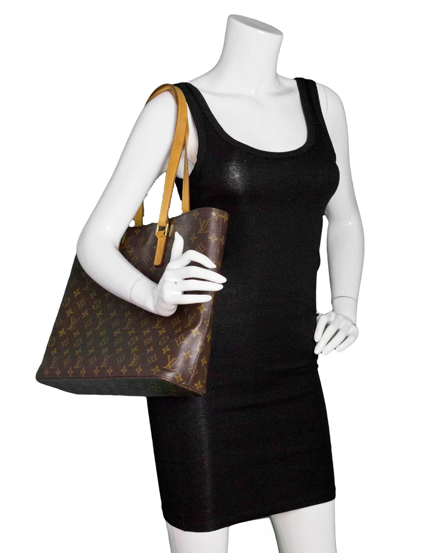 Louis Vuitton Monogram Luco Tote

Made In: Spain
Year of Production: 2000
Color: Brown
Hardware: Goldtone
Materials: Vachetta leather and coated canvas
Lining: Tan alacentra
Closure/Opening: Zip top
Exterior Pockets: None
Interior Pockets: Four wall