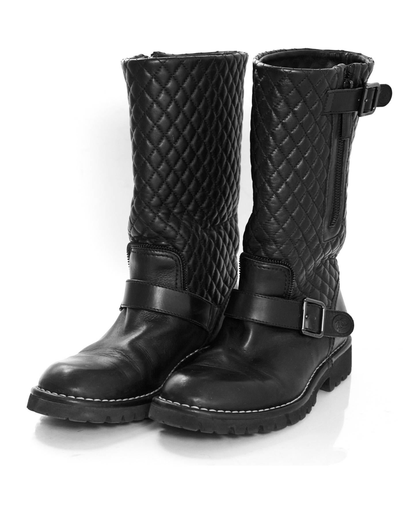 Chanel Black Quilted Leather Biker Boots Sz 38.5

Made In: Italy
Color: Black
Materials: Leather
Closure/Opening: Side zip closure
Sole Stamp: Chanel Made in Italy
Overall Condition: Excellent pre-owned condition with the exception of some creasing