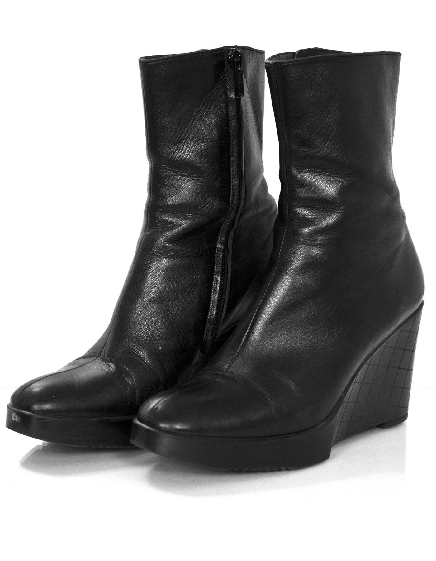 Robert Clergie Black Leather Wedge Ankle Boots Sz 6.5

Made In: France
Color: Black
Materials: Leather
Closure/Opening: Sisde zip closure
Sole Stamp: Robert Clergie Made in France
Overall Condition: Very good pre-owned condition with the exception