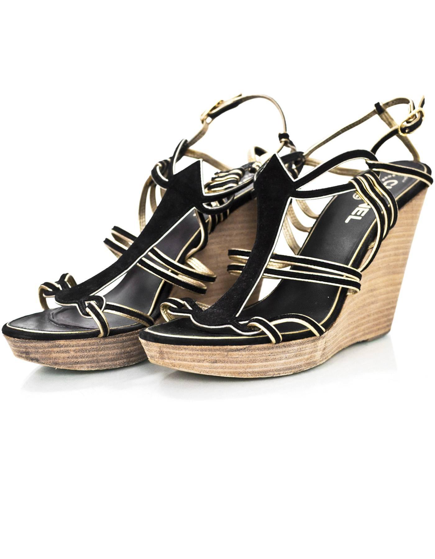 Chanel Black Suede Wedge Sandals Sz 40

Features gold trim

Made In: Italy
Color: Black, gold, brown
Materials: Suede
Closure/Opening: Buckle closure at ankle
Sole Stamp: CC Made in Italy 40
Overall Condition: Very good pre-owned condition with the