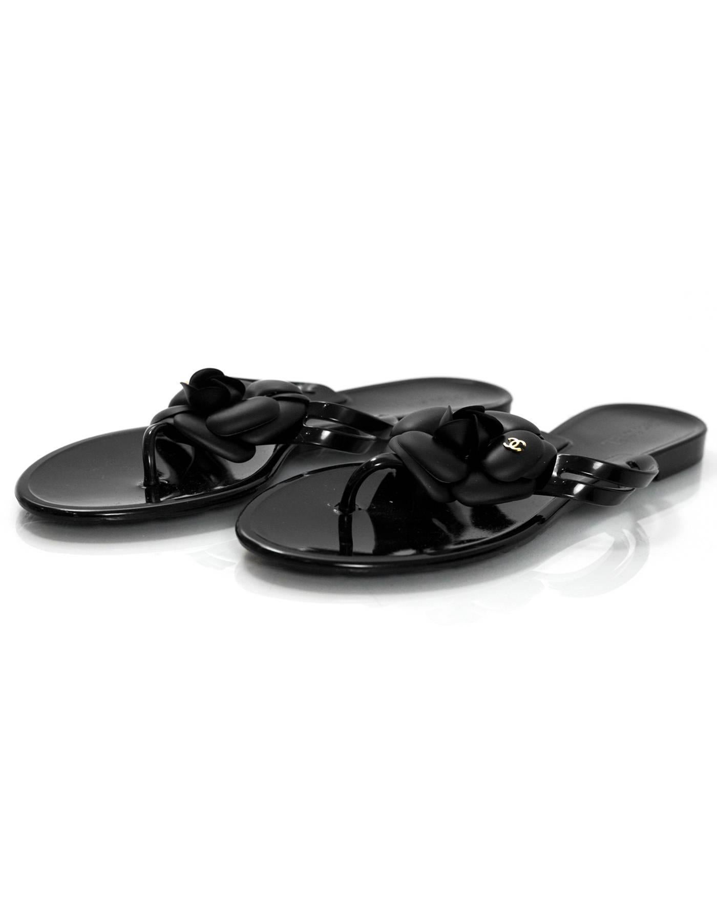 Chanel Black Jelly Camellia Sandals Sz 39

Made In: Italy
Color: Black
Materials: Rubber
Closure/Opening: Slide on
Sole Stamp: CC Made in Italy 39
Overall Condition: Excellent pre-owned condition, dont appear to be worn
Included: Chanel box, dust