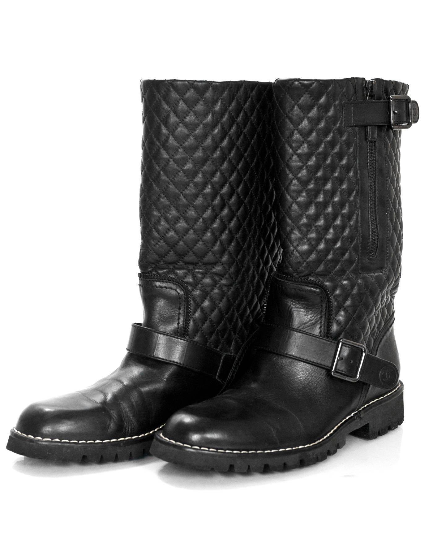 Chanel Black Quilted Leather Biker Boots Sz 40

Made In: Italy
Color: Black
Materials: Leather
Closure/Opening: Side zip closure
Sole Stamp: CC Chanel Made in Italy
Overall Condition: Excellent pre-owned condition with the exception of some creasing