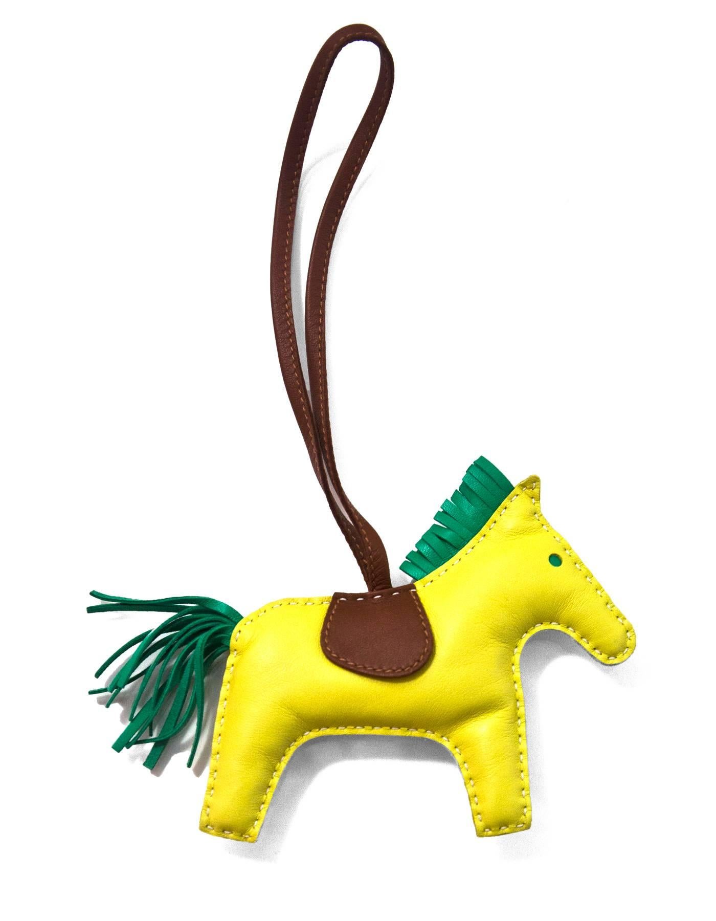 Hermes Lime Yellow, Menthe Green & Fauve Brown Rodeo Horse Charm 

Made In: France
Color: Lime Yellow, Menthe Green & Fauve Brown
Materials: Lambskin leather
Closure/Opening: None
Stamp: Hermes Paris Made in France
Overall Condition: Excellent