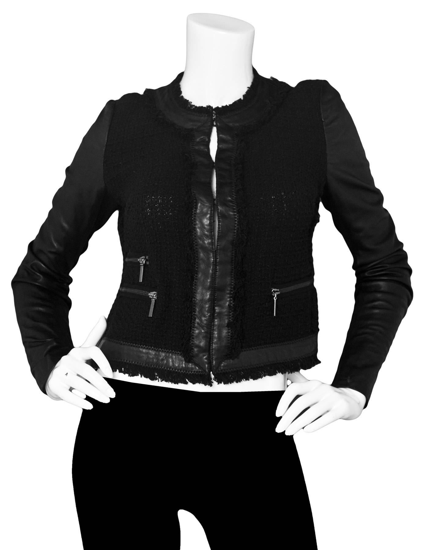 Rebecca Taylor Black Jacket with Leather Trim Sz 4
Features black leather sleeves with fringe and leather trim

Made In: China
Color: Black
Composition: 60% Cotton, 33% polyester, 7% wool
Lining: None
Closure/Opening: Front hook and eye